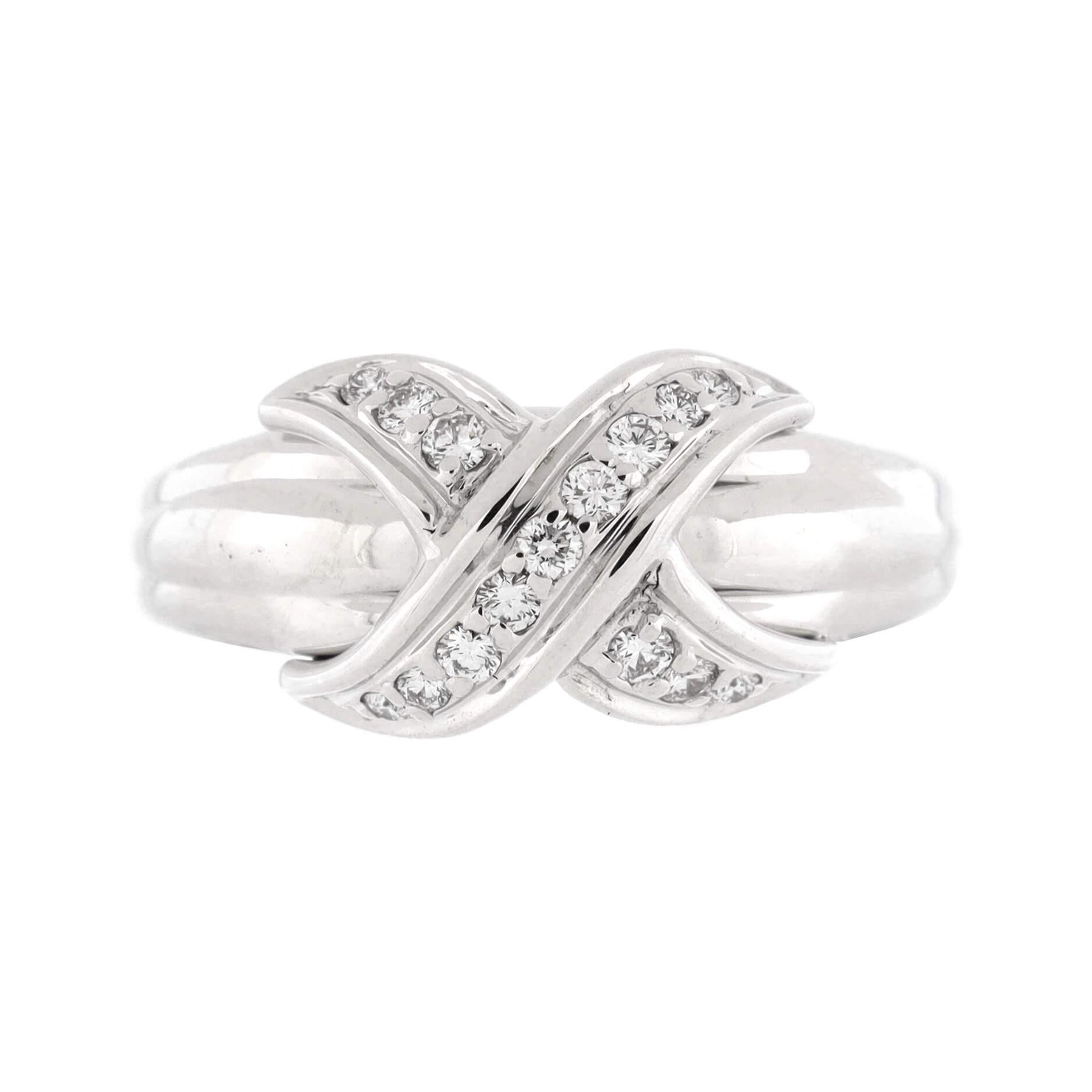 Condition: Good. Moderately heavy wear throughout commensurate with age.
Accessories: No Accessories
Measurements: Size: 6.5, Width: 3.00 mm
Designer: Tiffany & Co.
Model: Signature X Ring 18K White Gold and Diamonds
Exterior Color: White Gold
Item