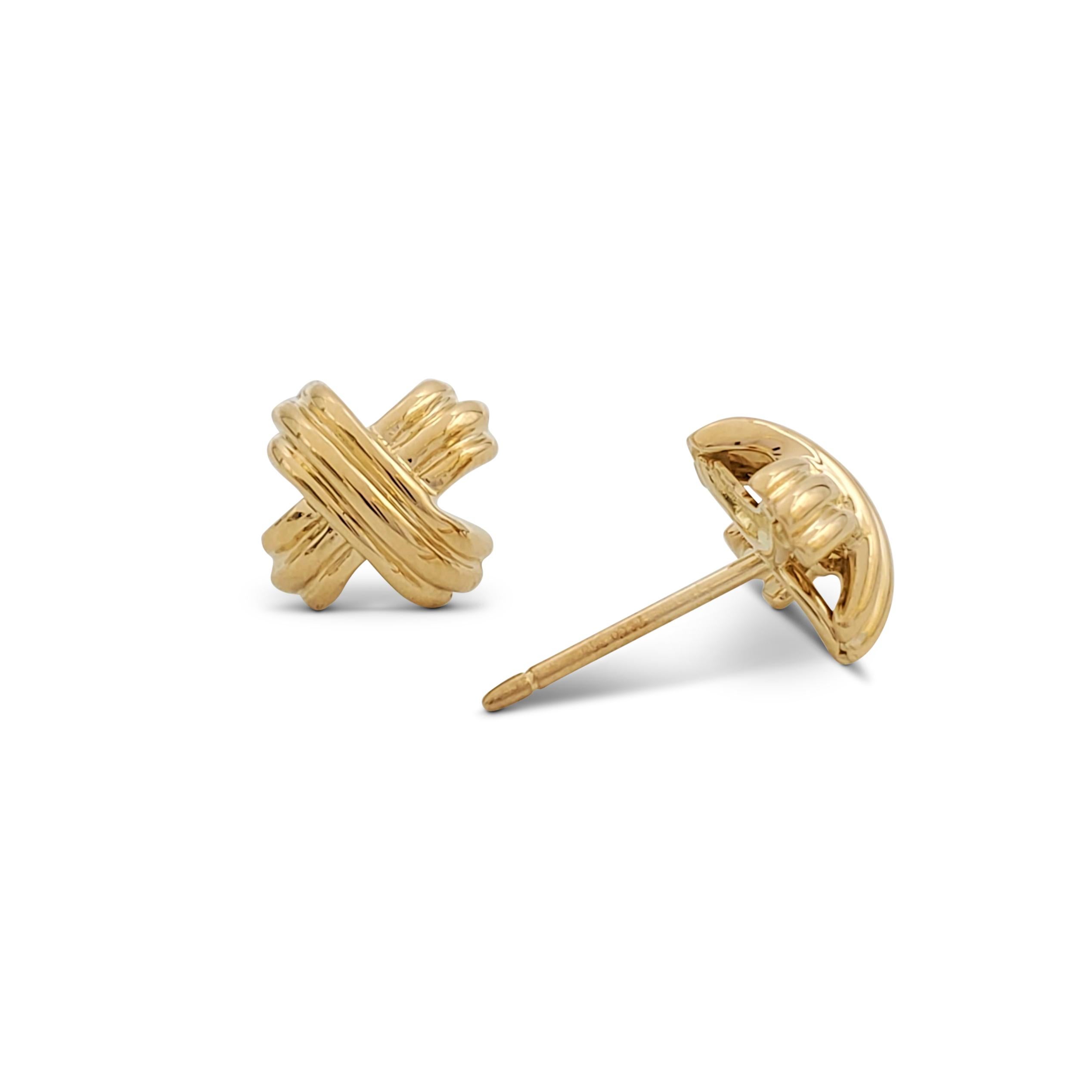 Authentic Tiffany & Co. 'Signature X' earrings crafted in 18 karat yellow gold. Signed T&Co., 750. The earrings are presented with the original pouch and outer box, no papers. CIRCA 1990s. 

Box: Yes (outer box)
Papers: No