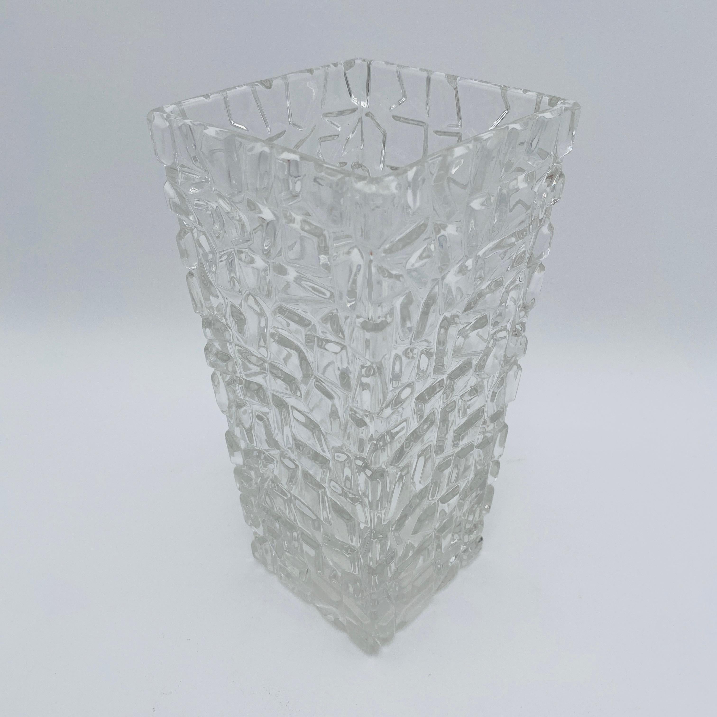 This contemporary Tiffany & Co crystal vase features a modern geometrical pattern design, making it stylish and elegant. The bottom of the vase is marked, 