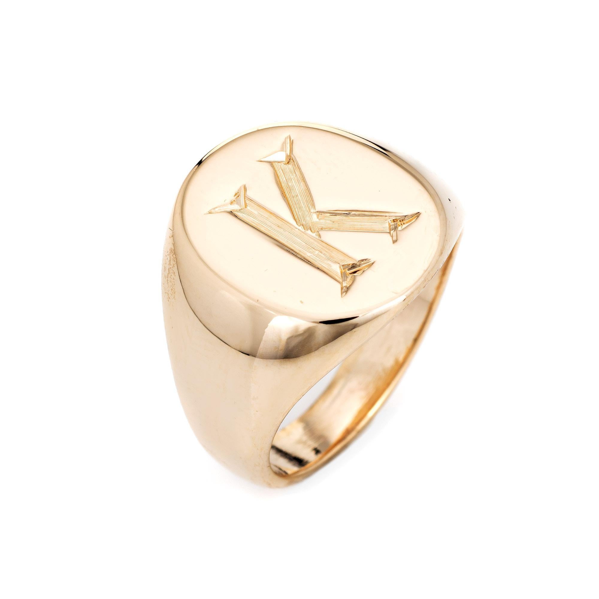 Finely detailed vintage Tiffany & Co signet ring crafted in 14k yellow gold. 

The oval signet mount is engraved with the letter 'K' (can be removed if desired). The signet ring is small in size and great worn on the pinky finger. The underside of