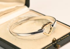 Tiffany Co Silver and Gold Bangle. 18K Yellow Gold Heart Center Sterling Silver