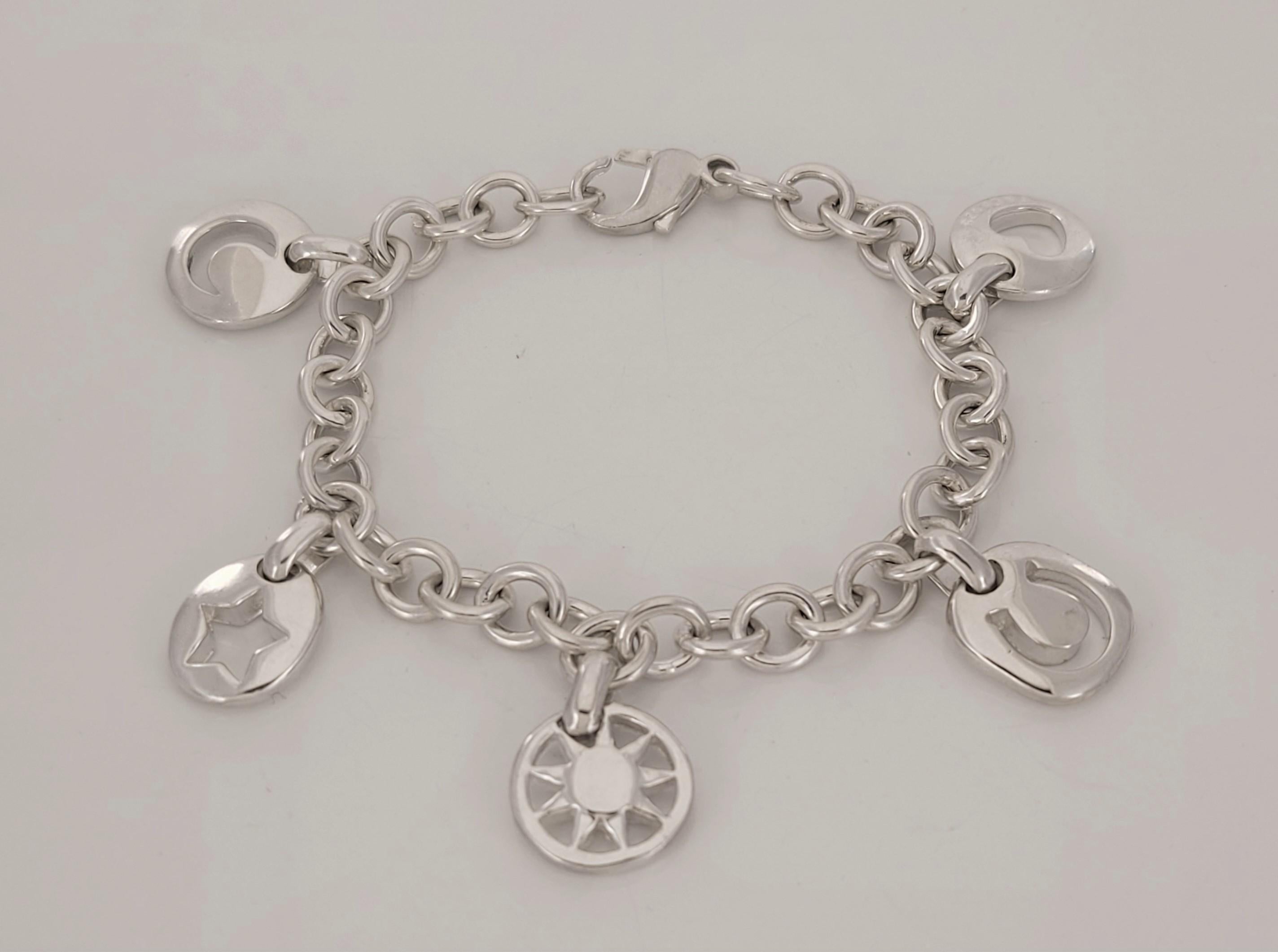 Brand Tiffany & co 
This Silver Tiffany Charm bracelet has five stencil charm bracelet
Heart, Sun, Star, Horseshoe 
Material Sterling Silver 925
Bracelet Length 7.5'' Long 
Chain weight 33.2 gr
Condition New, never worn
Comes with Tiffany & co pouch