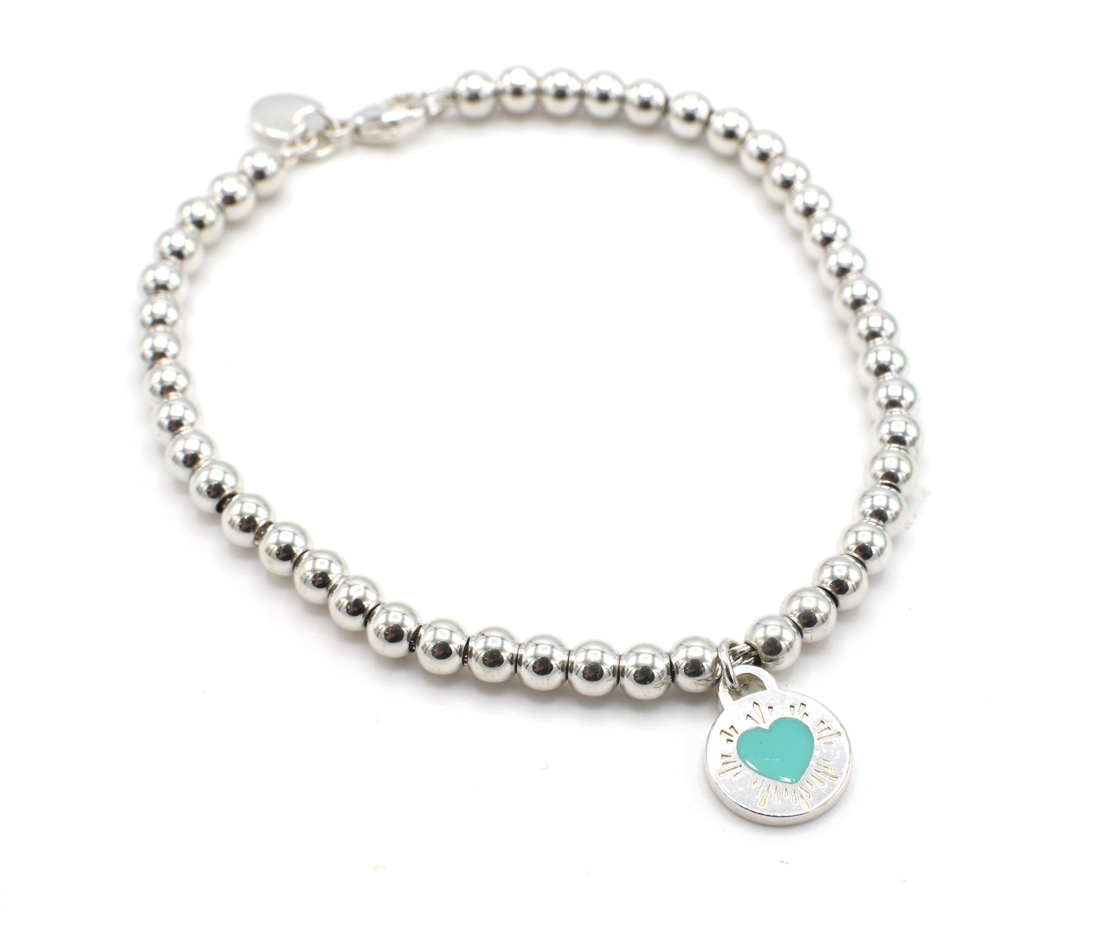 Tiffany & Co. Silver Return to Tiffany Blue Enamel Disc Heart Charm Bracelet 
Metal: Sterling Silver 925
Weight: 6.58 grams
Length: 7 inches
Width: 4mm
Signed: Please Return to Tiffany & Co. New York 925 AG 925 Tiffany & Co.
Charm: 10mm