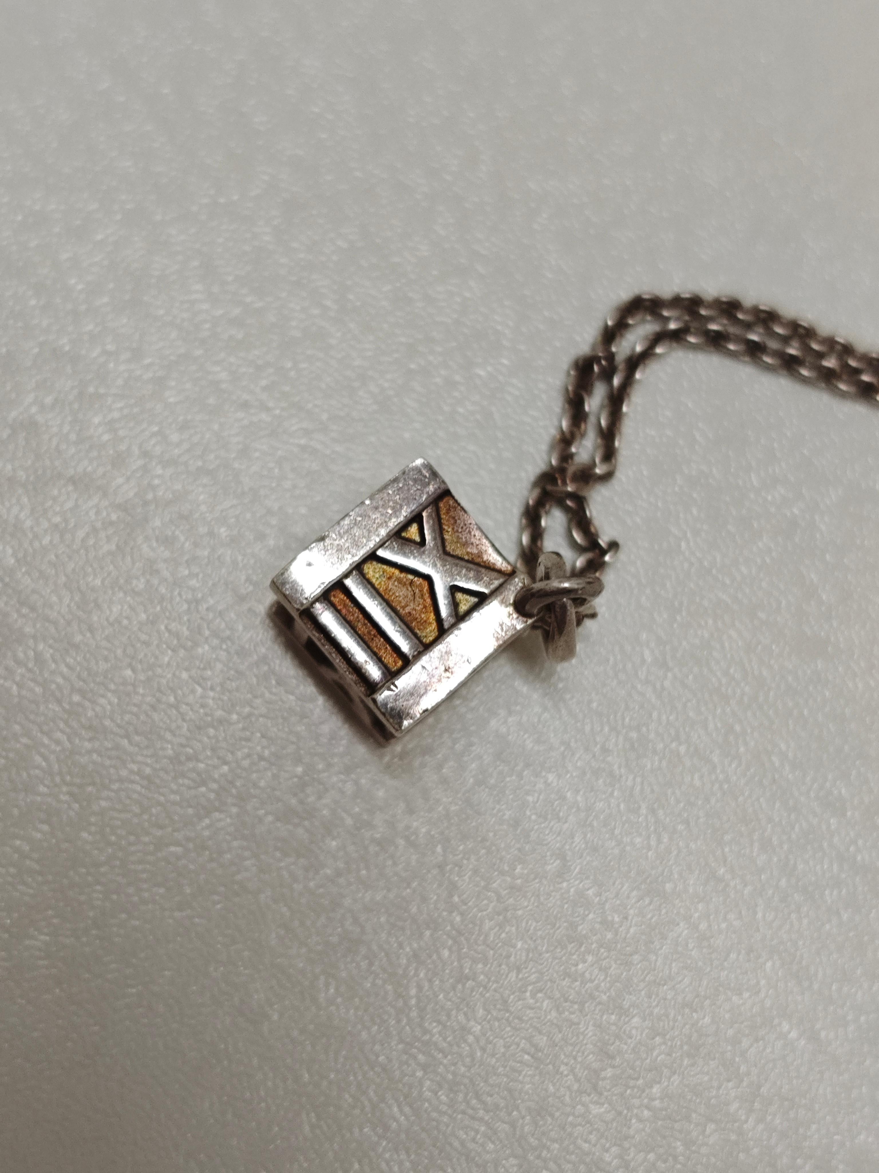 Tiffany & Co. Silver Roman Numeral Cube Necklace In Good Condition For Sale In PUTNEY, NSW