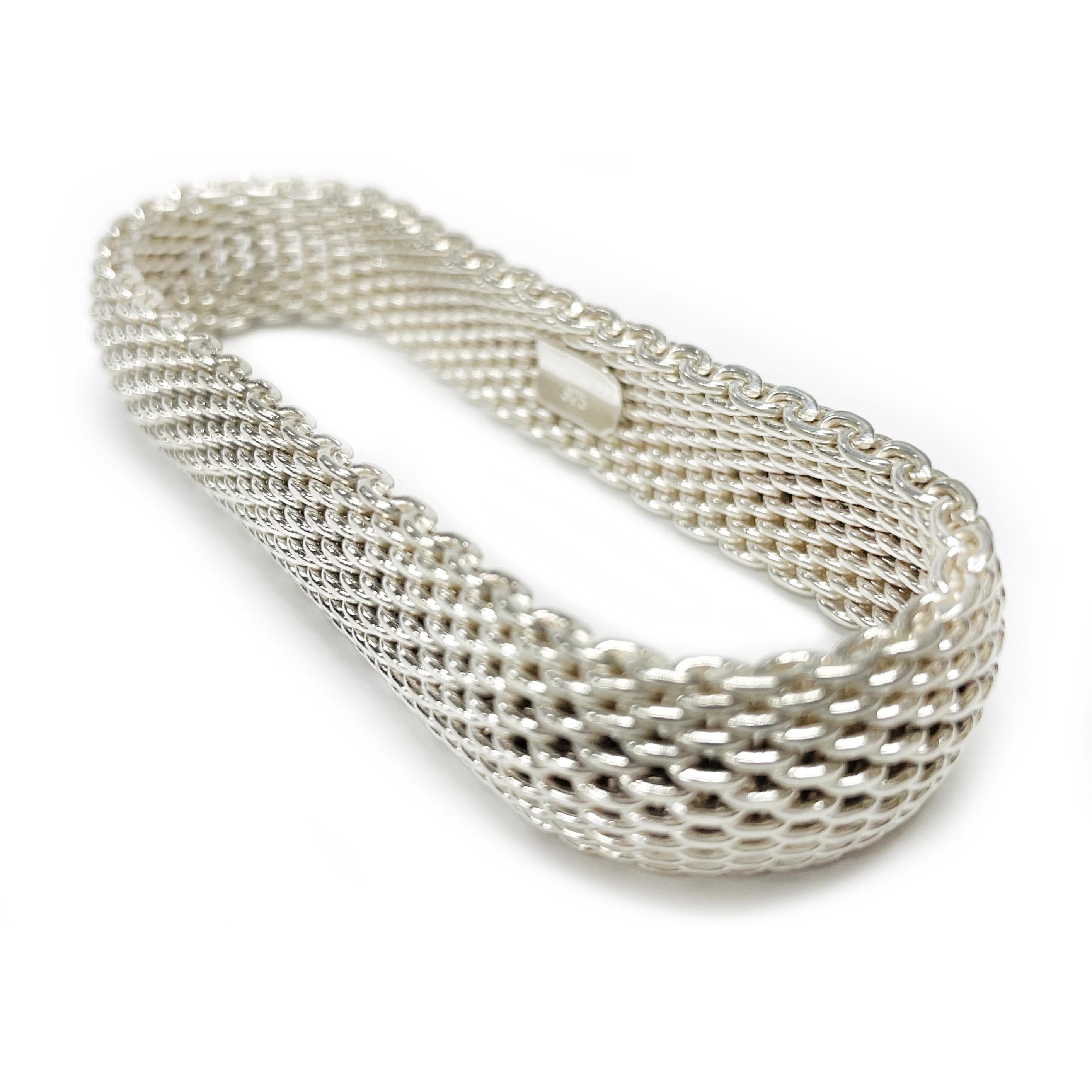 Tiffany & Co. 925 Silver Somerset Mesh Bracelet. A magnificent 15mm wide mesh bracelet that slips over the wrist. The continuous bold and intricate mesh design is a statement of beauty and refinement. Stamped on the inside clasp is Tiffany & Co.