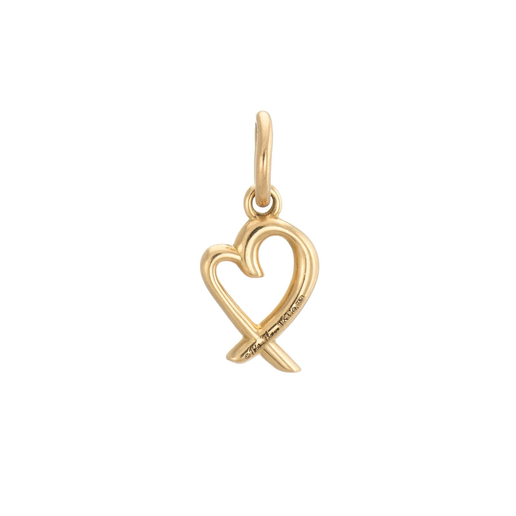Elegant and finely detailed pre-owned Tiffany & Co 18k gold loving heart charm.  

The small heart charm (3/4 x 1/4 inch) is designed by Paloma Picasso. Ideal for wear as a charm on a bracelet or as a pendant on a chain.

The charm is in very good