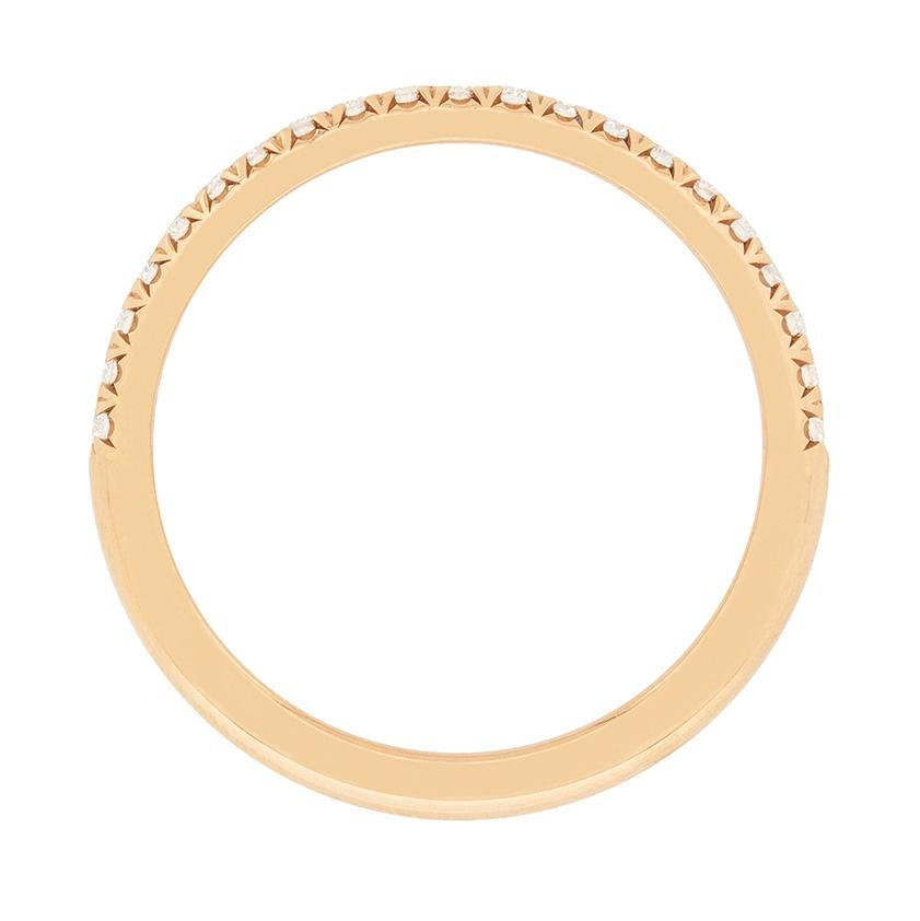 A classic half eternity band, part of Tiffany & Co.'s 'Soleste' collection. This band is made of 18 carat rose gold, and is set with 0.17 carat of round brilliant cut diamonds. They are excellent quality, with E to F colour grades and VVS clarity