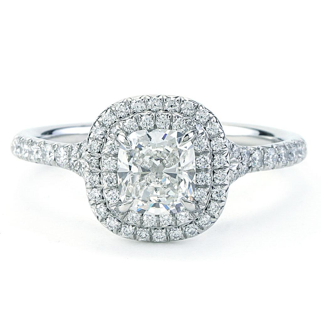 The ring is a size 7 (US), made of 950 platinum, and weighs 3.4 DWT (approx. 5.29 grams). It also has one cushion H-color, VVS2-clarity diamond weighing 1.07 CT, and 70 round diamonds.