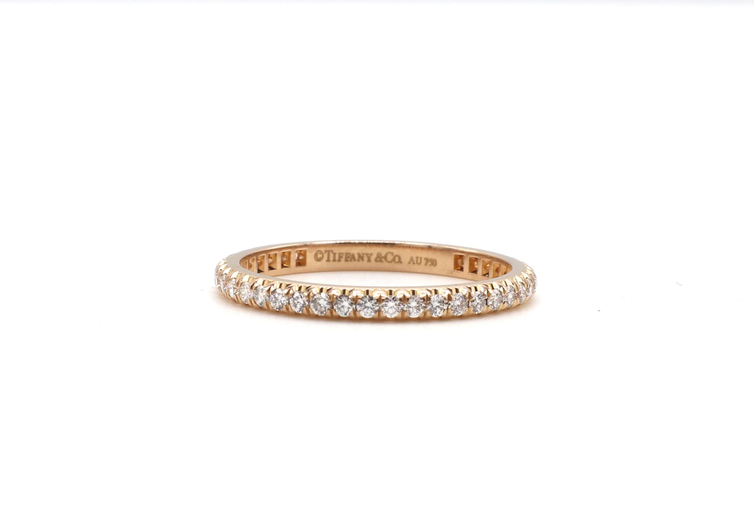 Tiffany & Co. Soleste 18 Karat Rose Gold Diamond Eternity Band Ring

Metal: 18 karat rose gold
Weight: 1.86 grams
Diamonds: Approx. 0.34 CTW G VS
Size: 6 (US)
Width: 2mm
Signed: Tiffany & Co. Au750
Retail: $3,600 USD