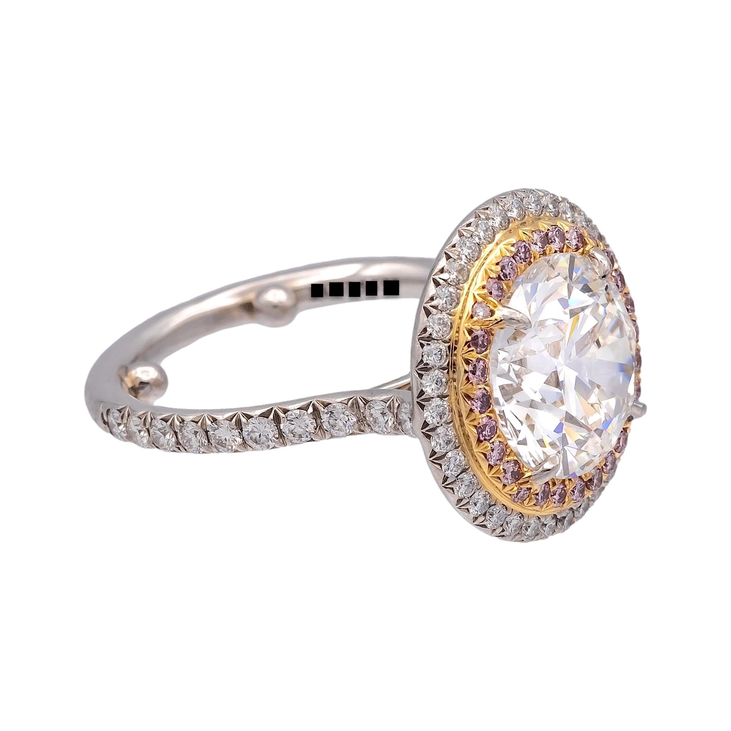 This Tiffany & Co. Double Soleste Ring, crafted in platinum , features a stunning 3.54-carat round brilliant-cut center diamond, graded F color and VVS2 clarity, surrounded by a double halo of pink and white diamonds. The side diamonds include 0.12