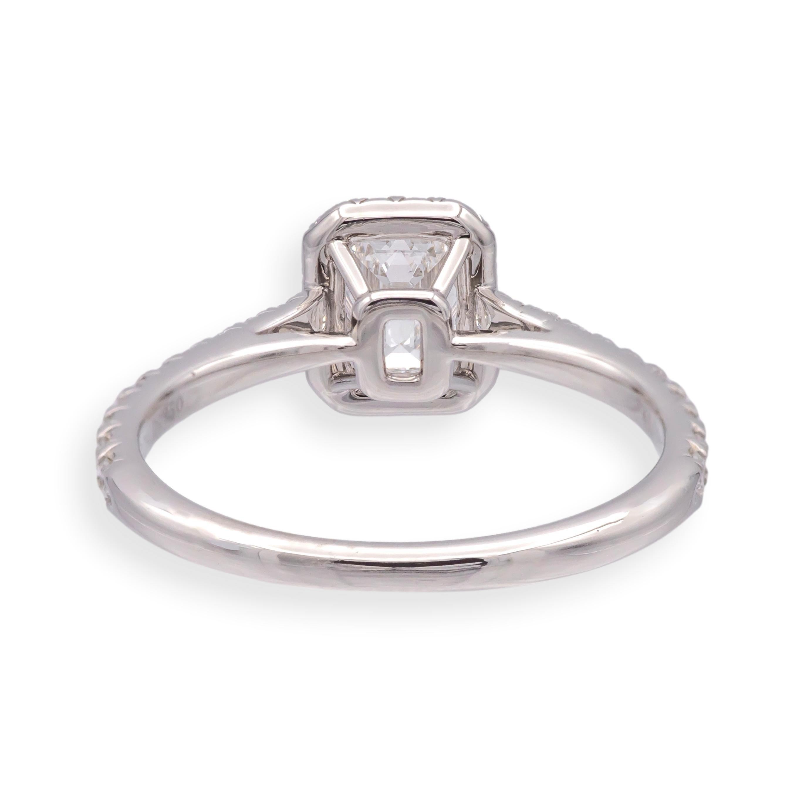 Tiffany & Co. Soleste .45 Ct Center Emerald Cut Halo Engagement Ring - E VS1 In Excellent Condition For Sale In New York, NY