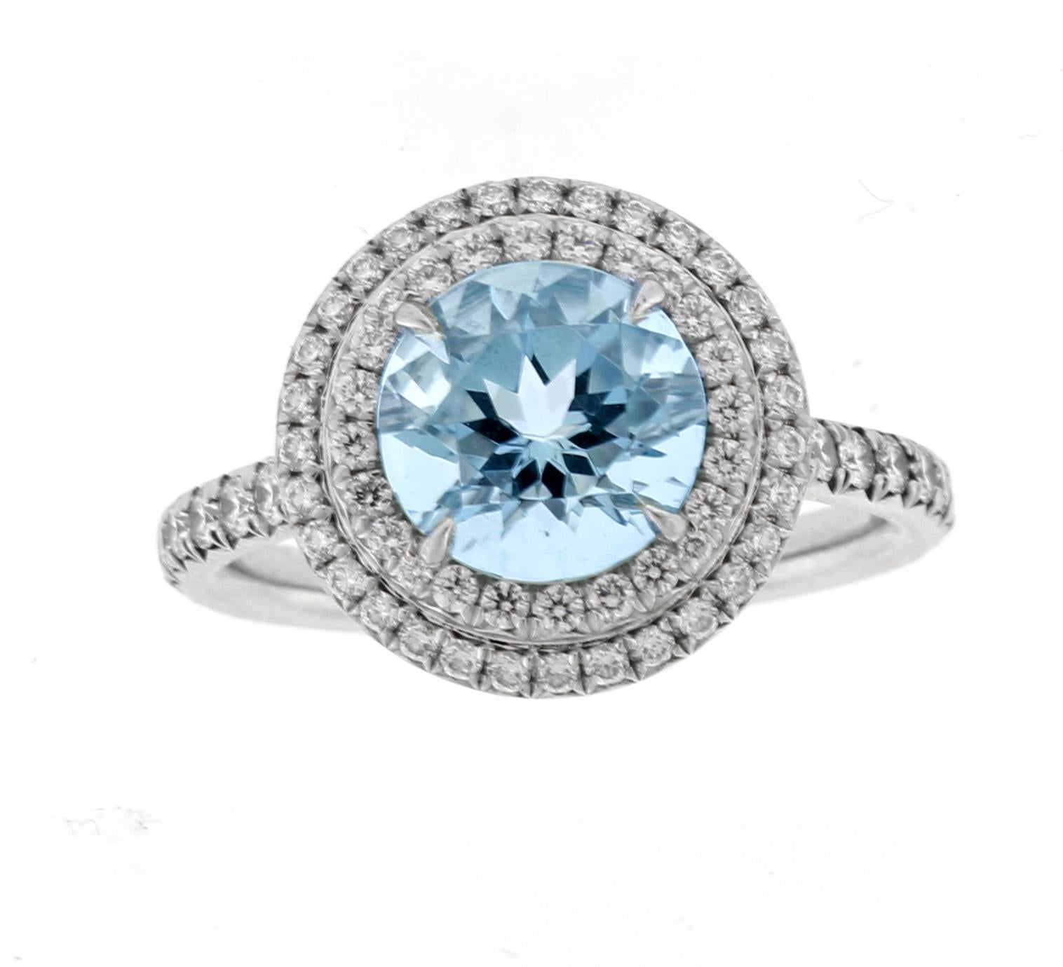 From Tiffany & Co.'s Soleste collection,  Shimmering diamonds surround an intensely colored aquamarine.
Platinum ring with a 8mm round  aquamarine and a double row of round brilliant diamonds.  (Larger size)
♦ Designer: Tiffany & Co.
♦ Metal: