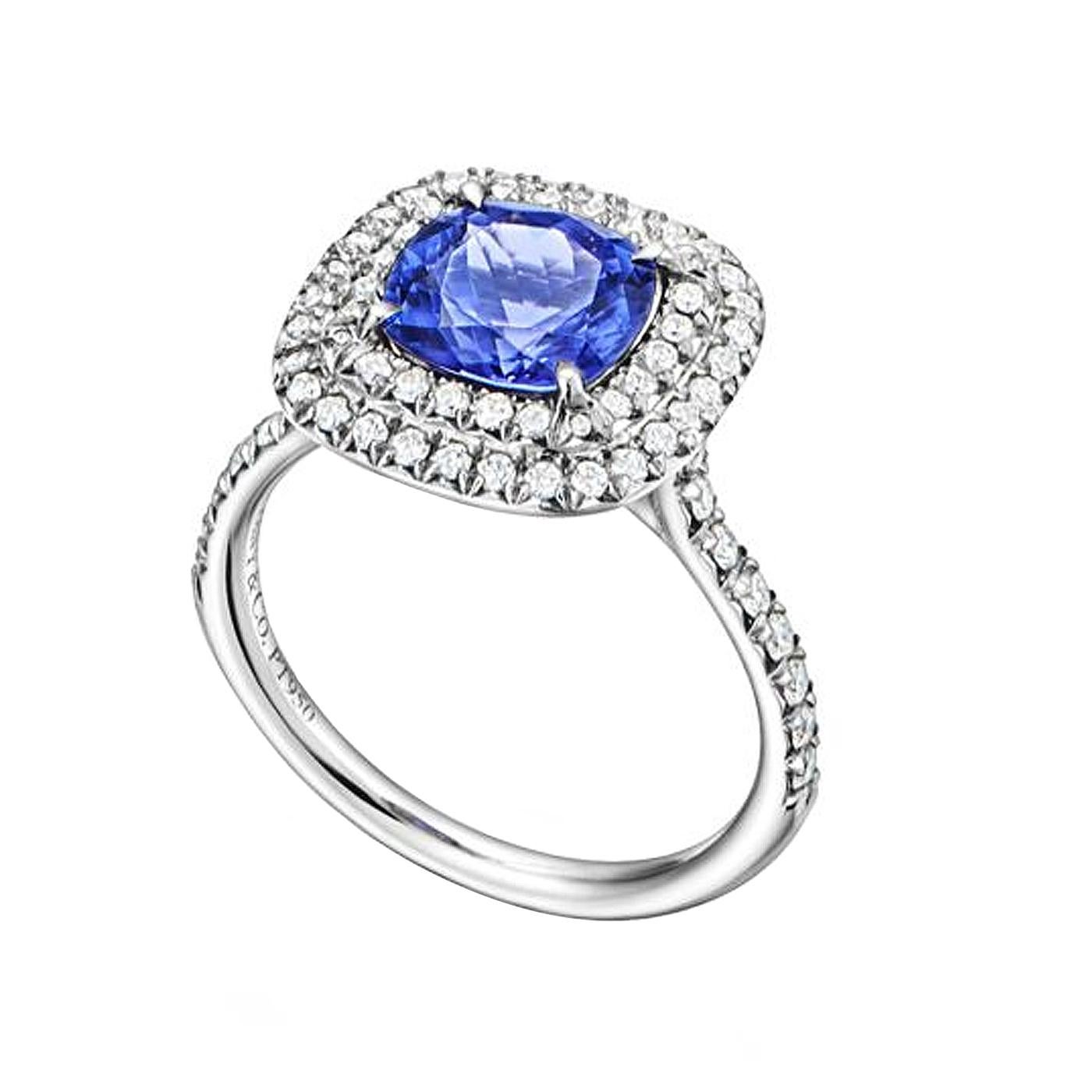 Ring in platinum with cushion-cut tanzanite and a double row of round brilliant diamonds. Tanzanite, carat weight 2.00. Diamonds, carat total weight .45.

Details:
Brand: Tiffany & Co
Type: Soleste Ring

Tanzanite:
Carat Weight: 2.00ct
Center Stone