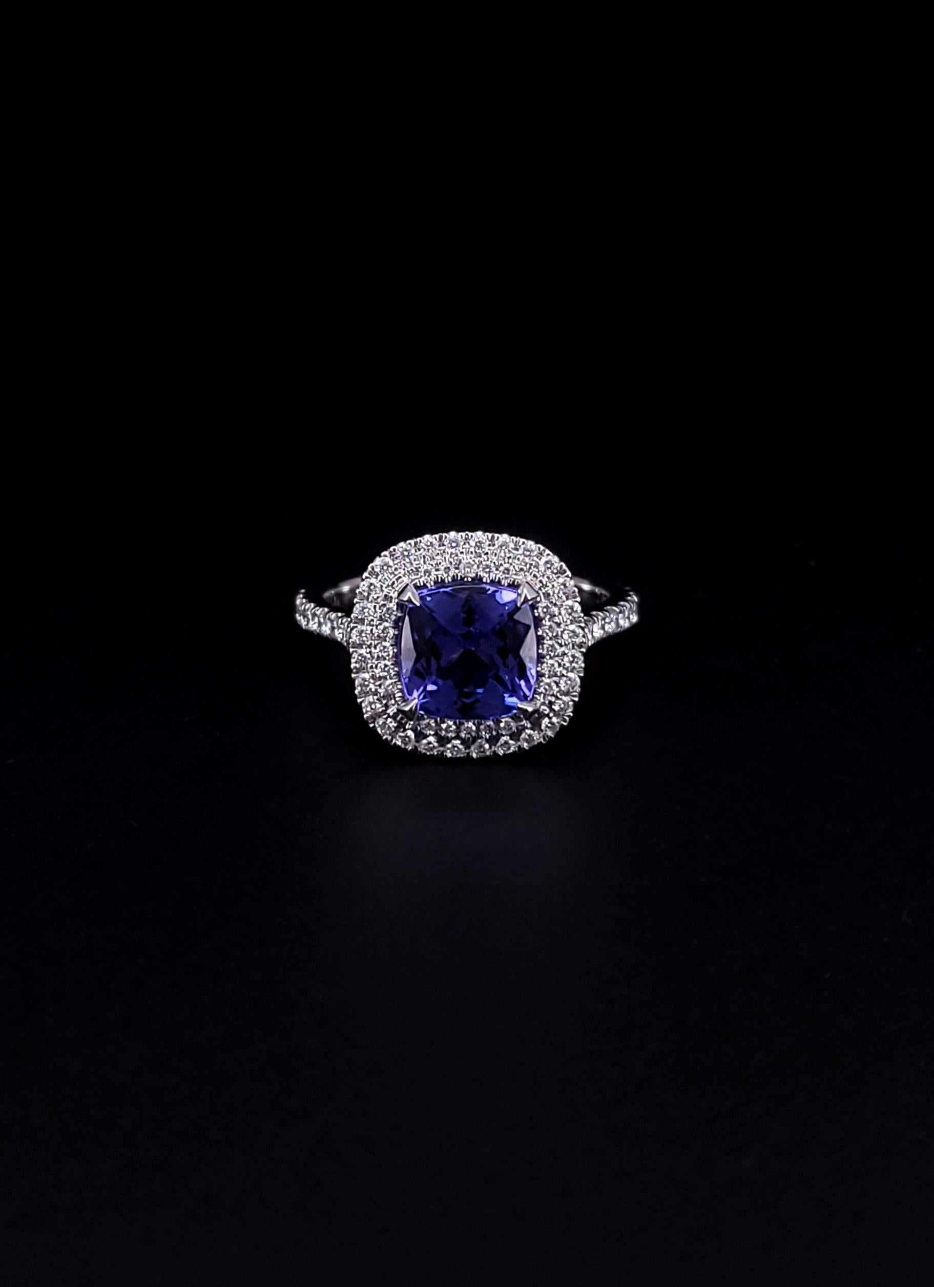 TIFFANY & CO. SOLESTE

Ring in platinum with cushion-cut tanzanite and a double row of round brilliant diamonds. Tanzanite, carat weight 2.00. Diamonds, carat total weight .45.

RING
Material: Platinum
Size: 6.25
Weight: 7.6 Grams
Face: 12.9mm x