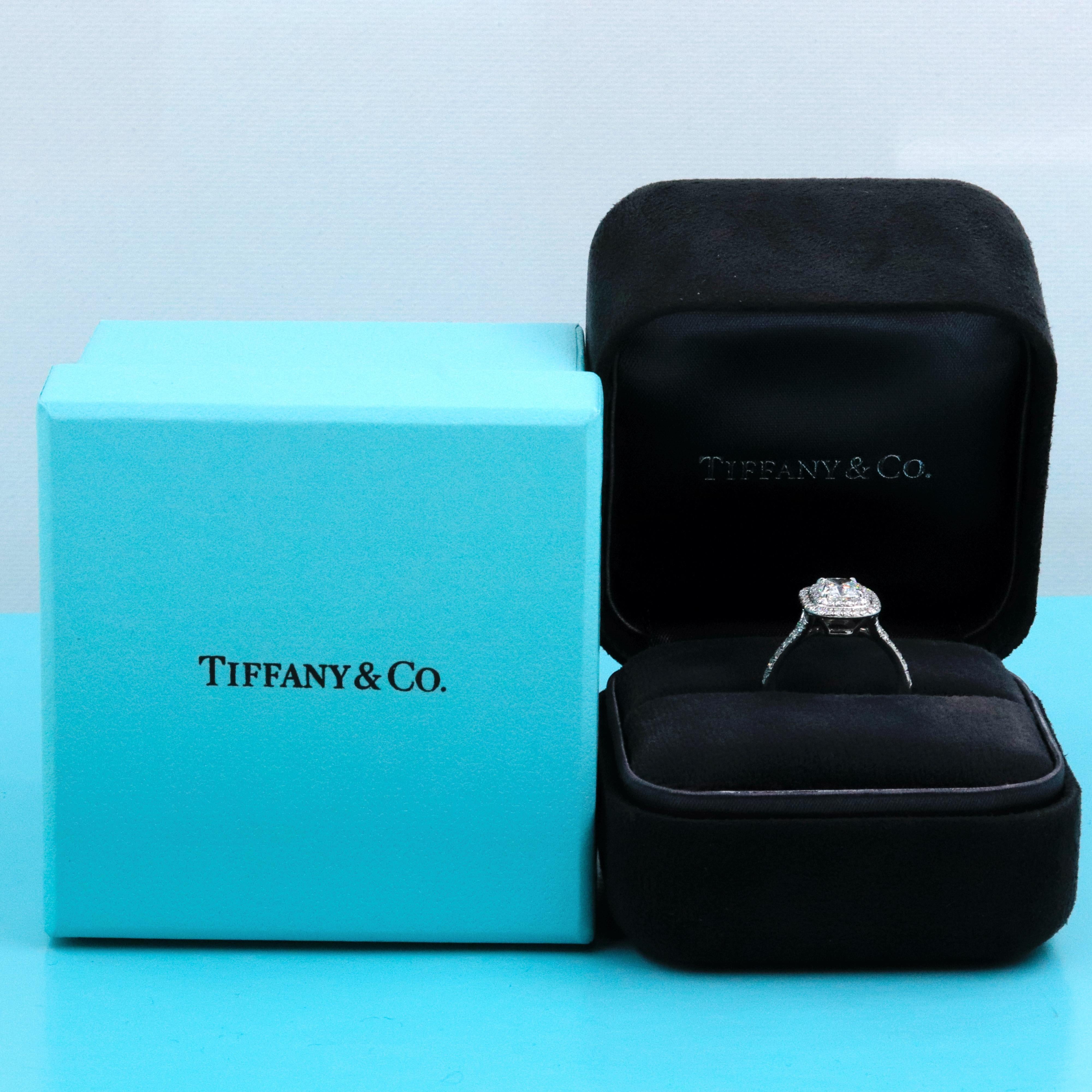 Tiffany & Co.

Style:  Soleste Double Halo  Engagement Ring
Metal:  Platinum
Size:  5 sizable
TCW:  1.30 tcw
Main Diamond:  Cushion Modified Brilliant 0.95 cts 
Color & Clarity:  G - VS1
Accent Diamonds:   2 Rows Round Brilliant Diamonds 0.35 tcw D