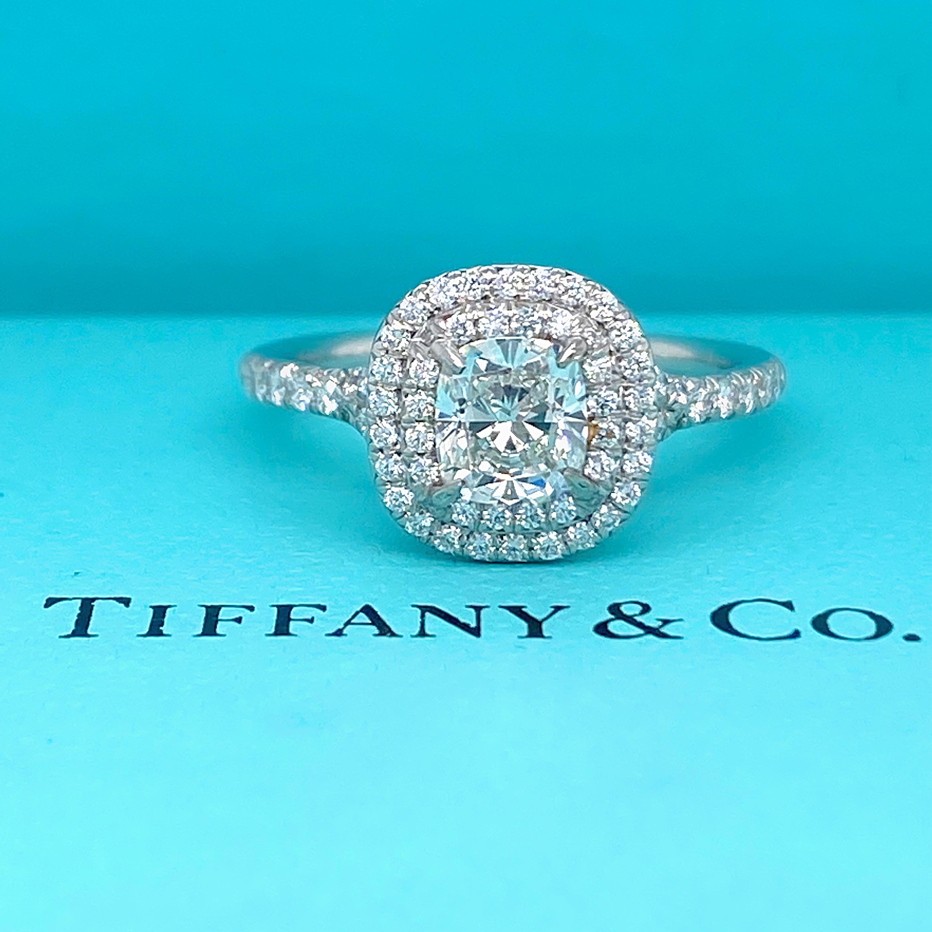 TIFFANY & CO Soleste Diamond Engagement Ring
Style:  Double Halo 
Diamond Number:  34823499
Metal:  Platinum
Size:  6.5 sizable
TCW:  1.45 tcw
Main Diamond:  Cushion Brilliant Diamond 1.00 cts
Color & Clarity:  I, VS1
Accent Diamonds:  72 Round