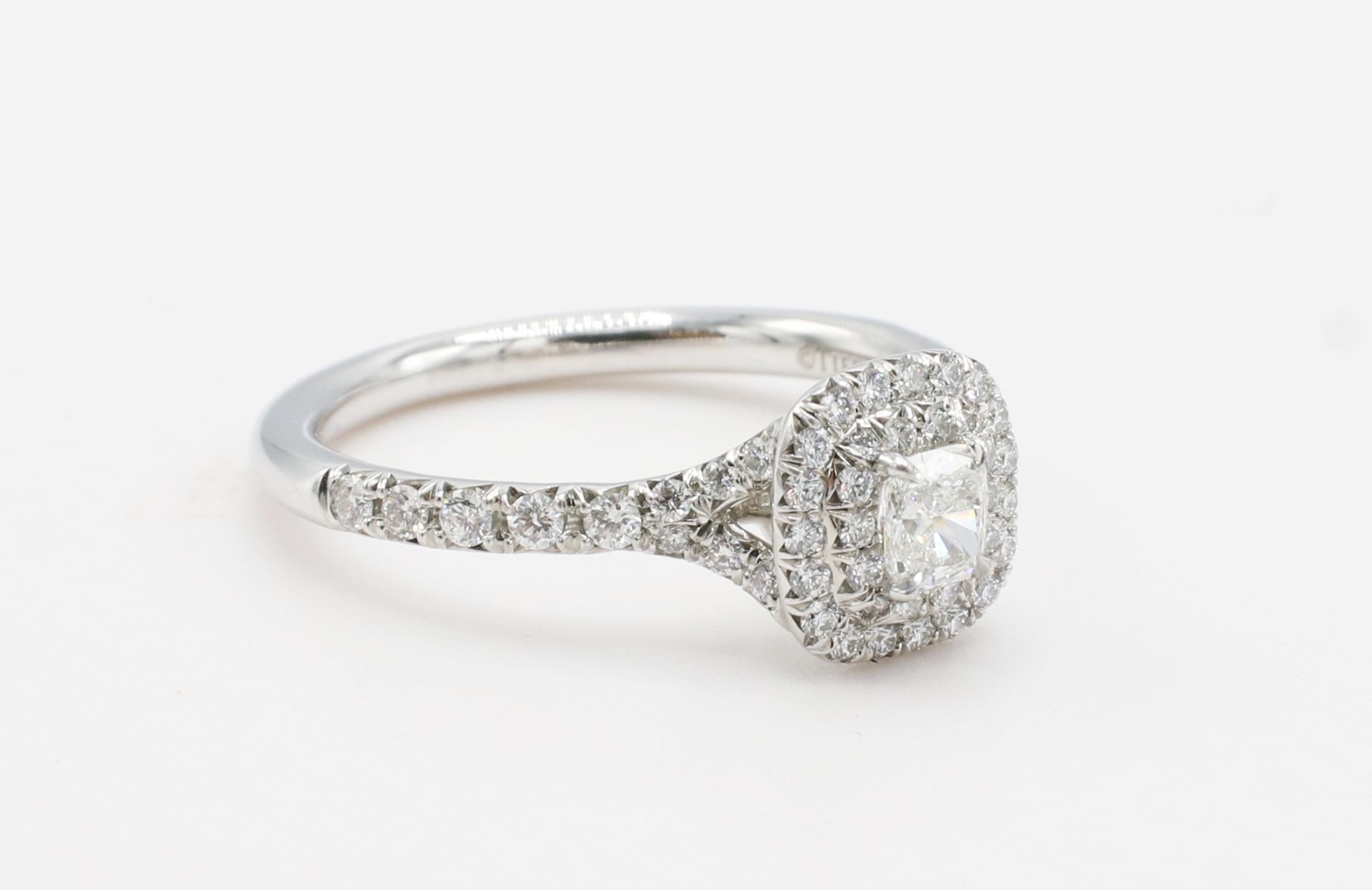 Tiffany & Co. Soleste Cushion Double Row Halo Diamond Engagement Ring
Diamond: .22 carat cushion F VVS2
Accent diamonds: .25 CTW D-G IF - VS2 round brilliant diamonds
Metal: Platinum
Weight: 4.34 grams
Size: 6 (US)
Top: 7.5 x 7.5mm
Retail: $4,700