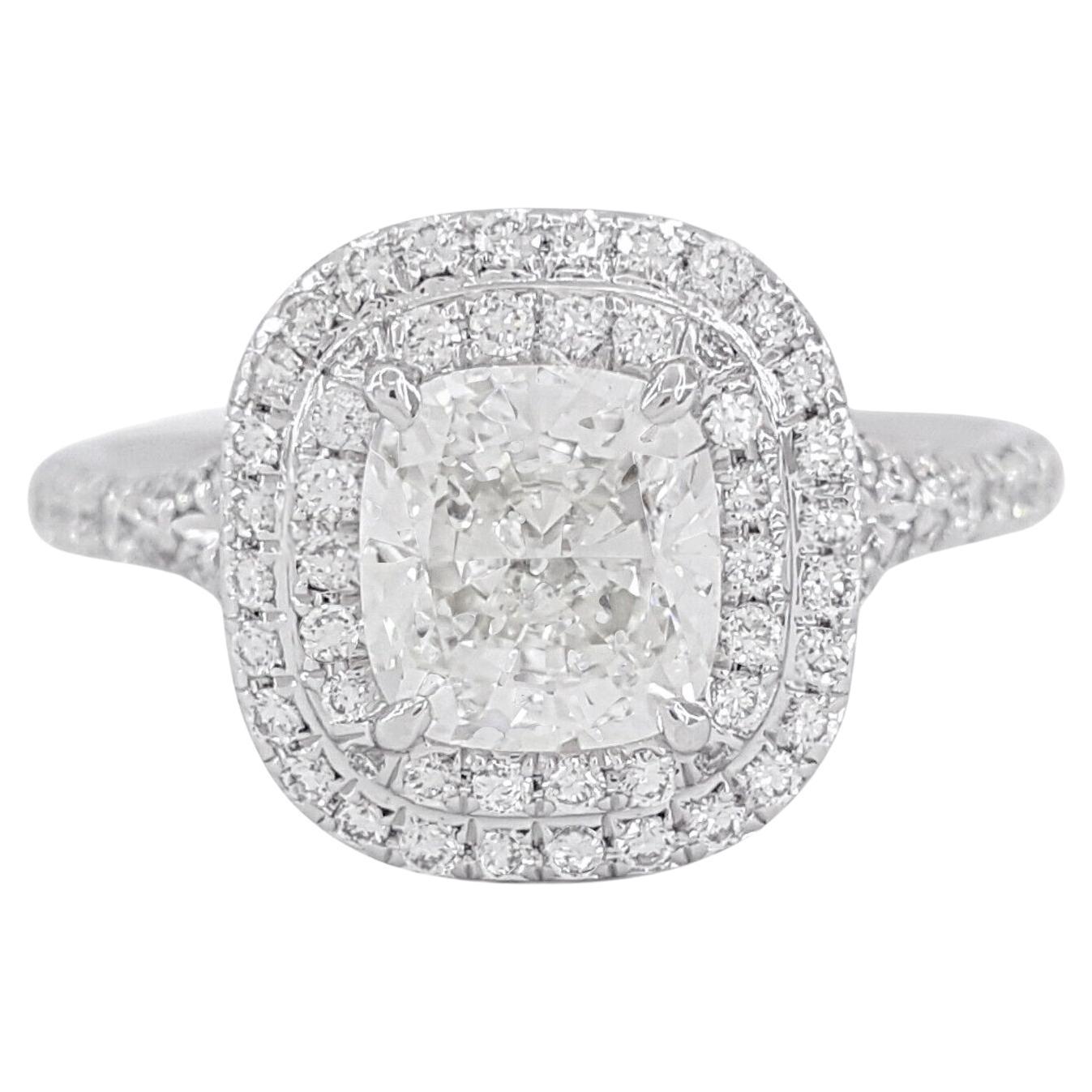 Tiffany & Co. Platinum Soleste® 1.52 ct Cushion Excellent Ideal Cut Diamond Double Halo Engagement Ring.

The ring weighs 4.7 grams, size 4, the center stone is a Cushion Brilliant Cut Diamond weighing 1.12 ct, G in color, VVS2 in clarity. The
