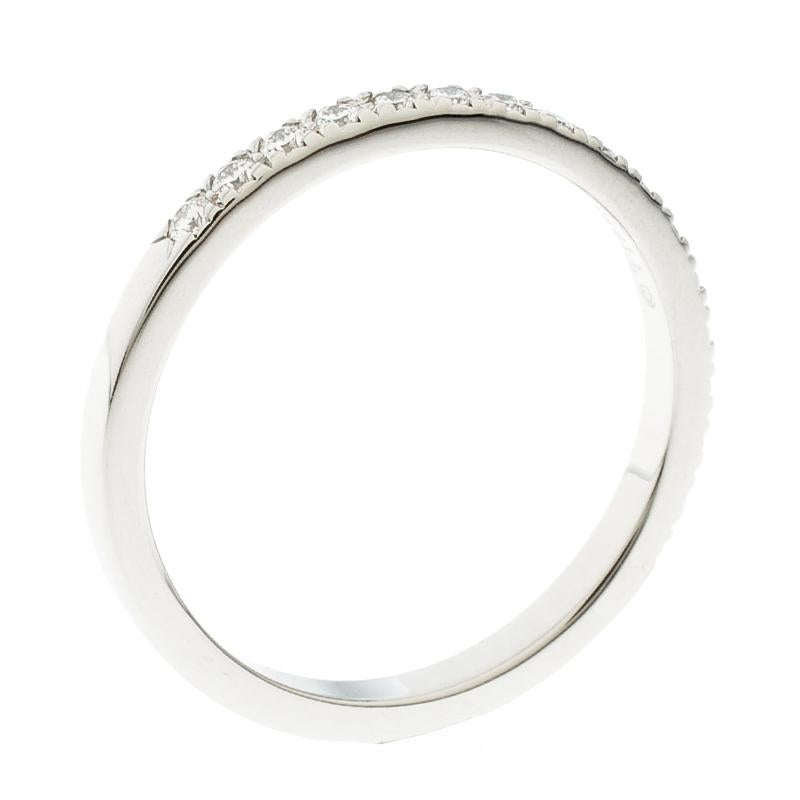 Seal the bond of love with this Half eternity wedding band ring from the house of Tiffany and Co. Designed from a platinum body, this ring features diamonds embedded all over it. We love the simplicity and elegance of this ring that can be worn as
