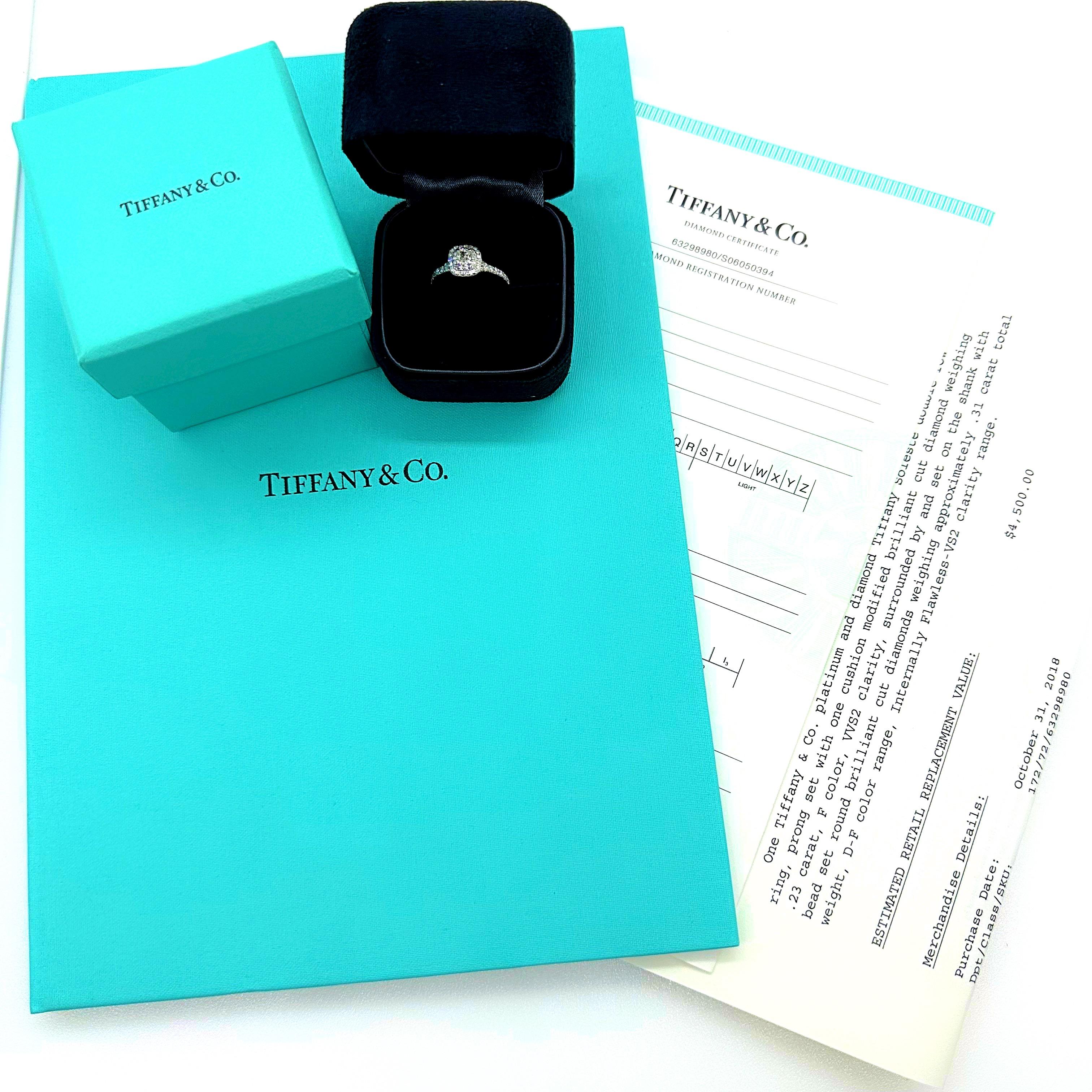 Tiffany & Co Double Row Soleste Diamond Engagement Ring
Style:  Halo with Bead Set Diamond Band
Ref. number:  63298980 / S06050394
Metal:   Platinum Pt950
Size / Measurements:  5 sizable / 2 mm 
TCW:  0.54 tcw
Main Diamond:  Cushion Brilliant 0.23