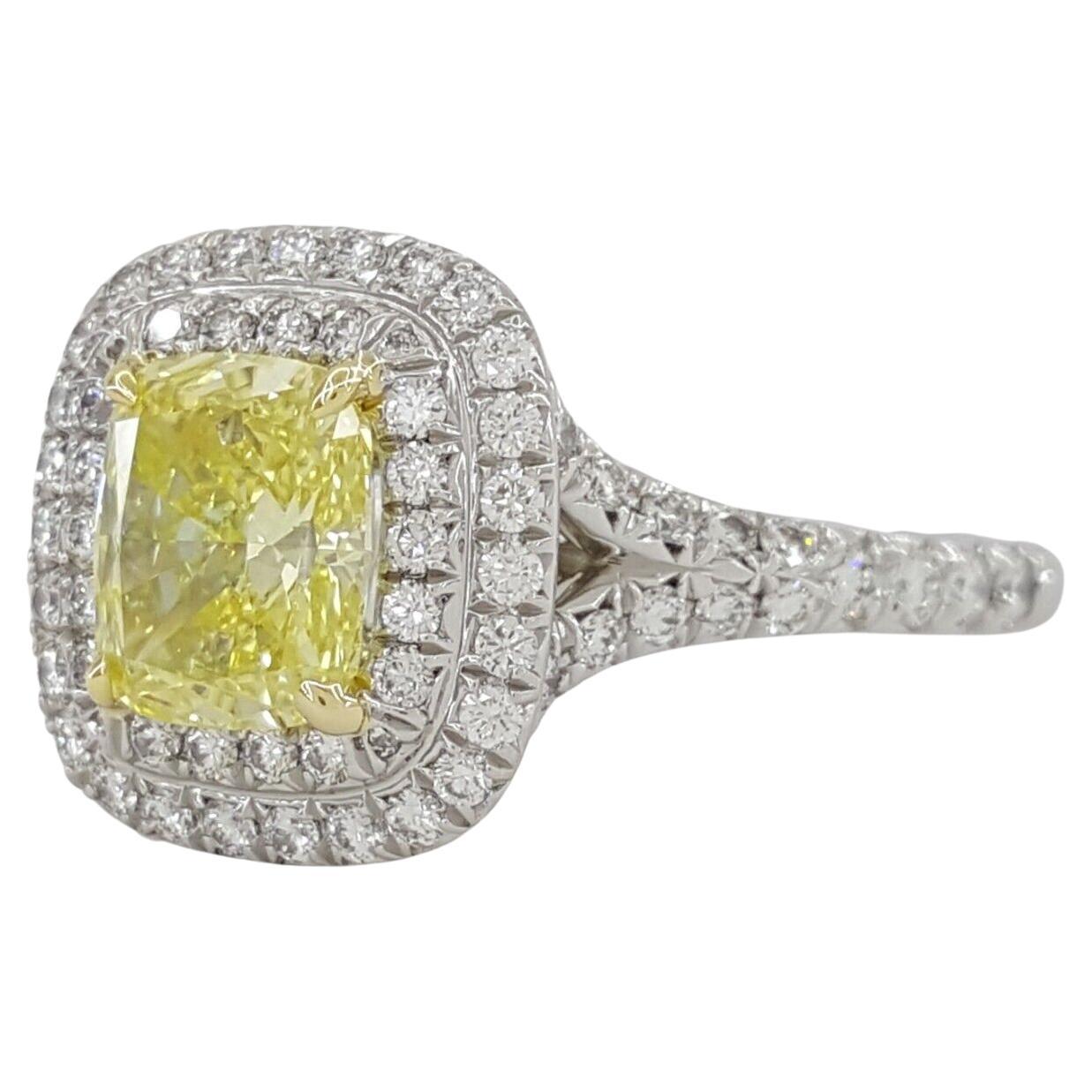 The ring weighs 5.3 grams, size 6.25, the center stone is a Natural Fancy Yellow Cushion Brilliant Cut Diamond Weighing 1.10 ct, Fancy Yellow in Color, VS2 in clarity, Excellent Cut, Excellent Polish, Very Good Symmetry, None Fluorescence, with