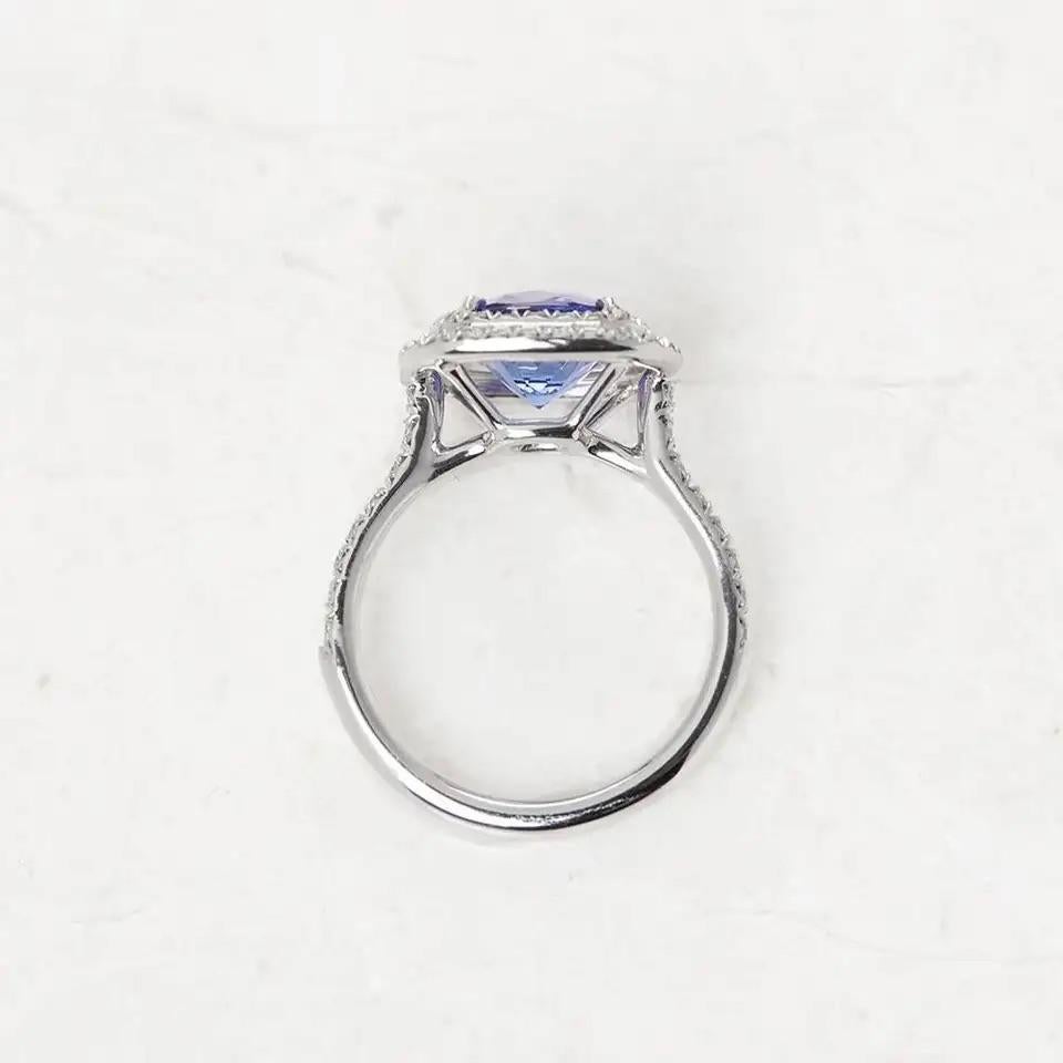 Tiffany Co Soleste Ring in platinum with a cushion-cut tanzanite and a double row of round brilliant diamonds. Tanzanite, carat weight approximately 2.00. 
Diamonds, carat total weight approximately  .45.
Size: 6
Condition: excellent , no