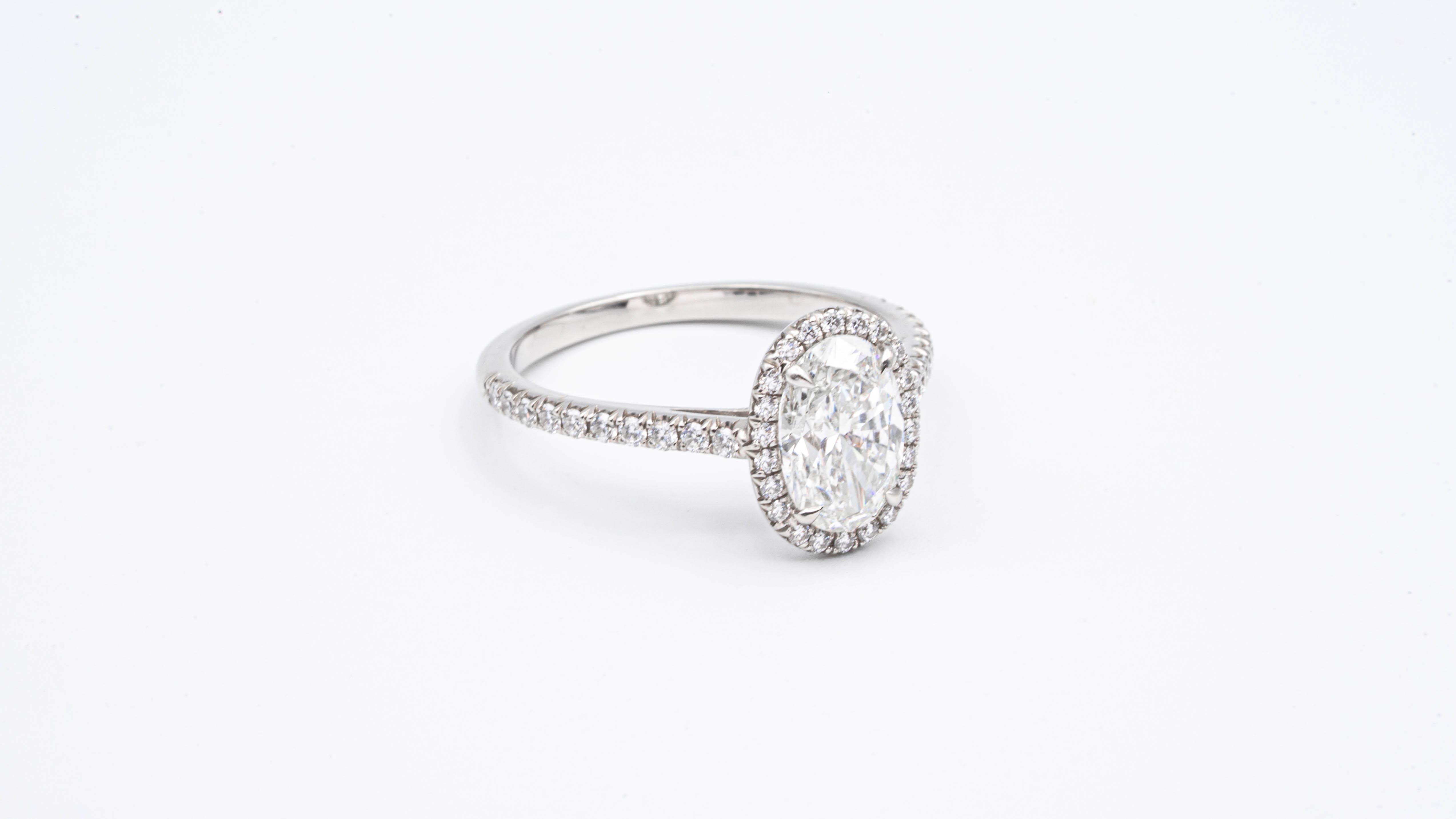 tiffany soleste oval halo engagement ring with a diamond platinum band
