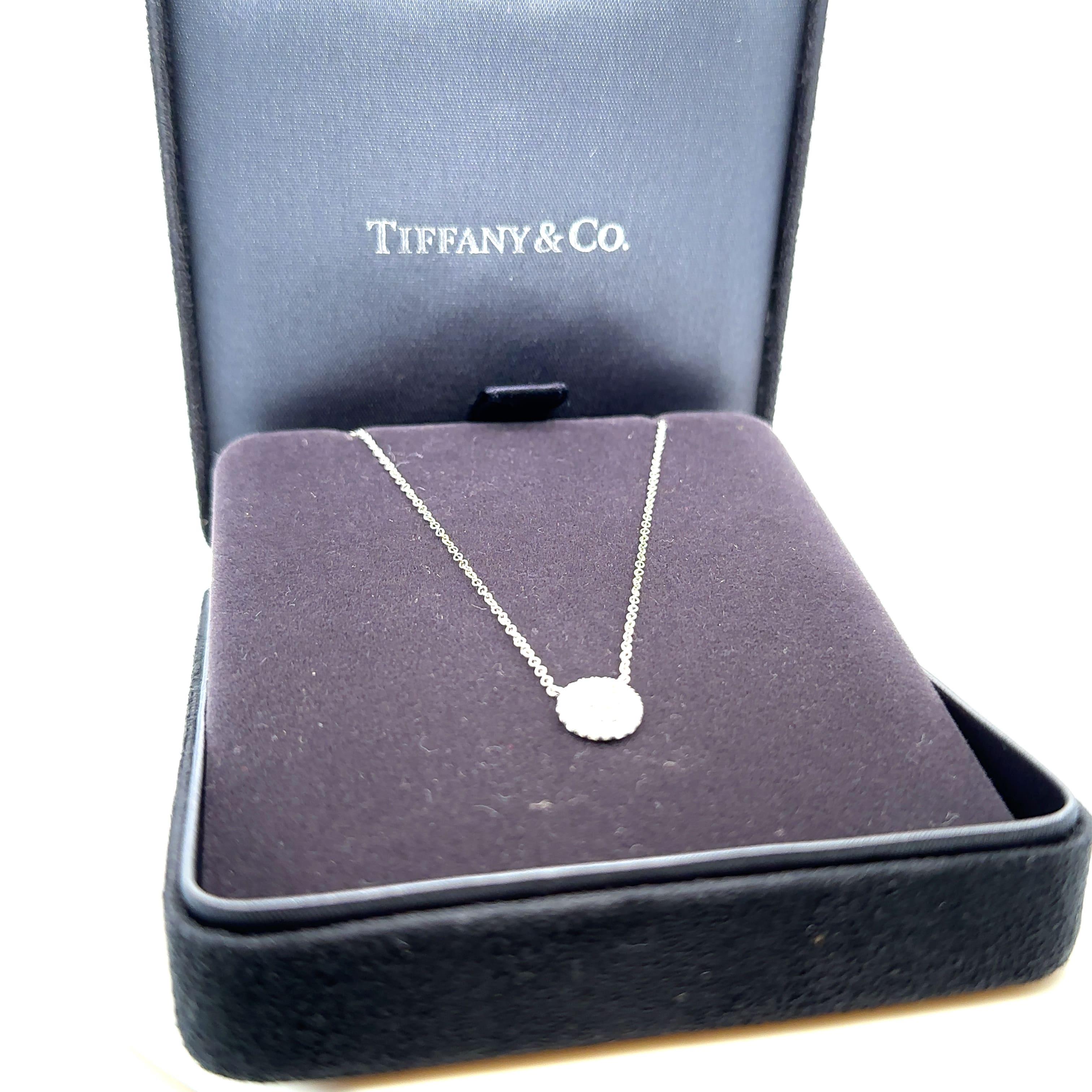 Unique features: 

Tiffany Soleste Pedant in platinum with round brilliant diamonds. One centre round brilliant diamond.

Metal: Platinum
Carat: 0.30ct
Colour: G-J
Clarity:  IF-SI1
Cut: Round Brilliant
Weight: N/A
Engravings/Markings: