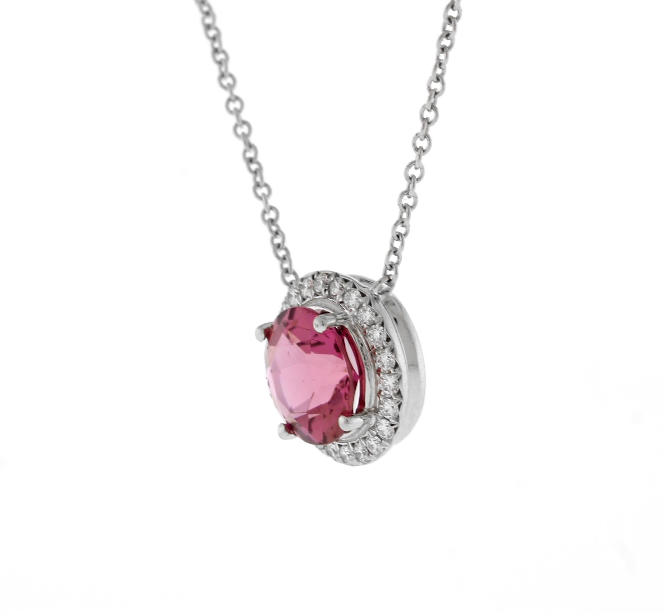 From Tiffany & Co.'s Soleste collection, Shimmering diamonds surround an intensely colored pink Tourmaline.
Platinum Pendant with a 7.5mm pink Tourmaline and a row of round brilliant diamonds. (Large size)
♦ Designer: Tiffany & Co.
♦ Metal: