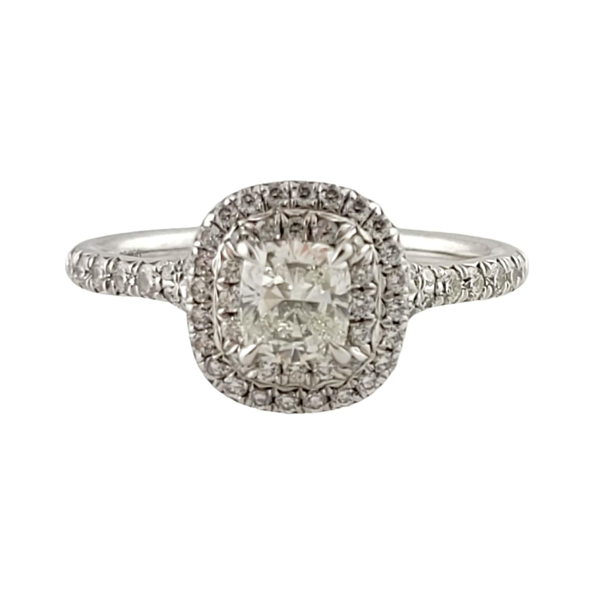 Tiffany & Co Platinum Engagement Ring

This double halo style engagement ring from the Tiffany & Co. Soleste Collection is set in Platinum.

Center diamond is a cushion cut stone. 
Carat weight: .59cts
Clarity: VS2
Color: H
Crown Inscription: T &