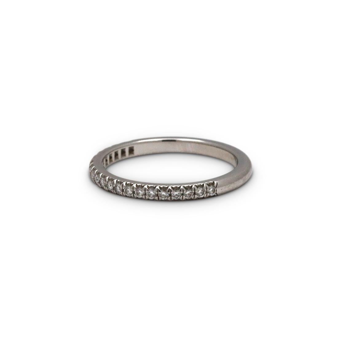 Authentic Tiffany & Co. 'Soleste' Half Eternity band crafted in platinum and set with approximately 0.17 carats of glittering round brilliant cut diamonds on half of the band. US Size 5 1/4. Signed Tiffany & Co., PT950. The ring is not presented