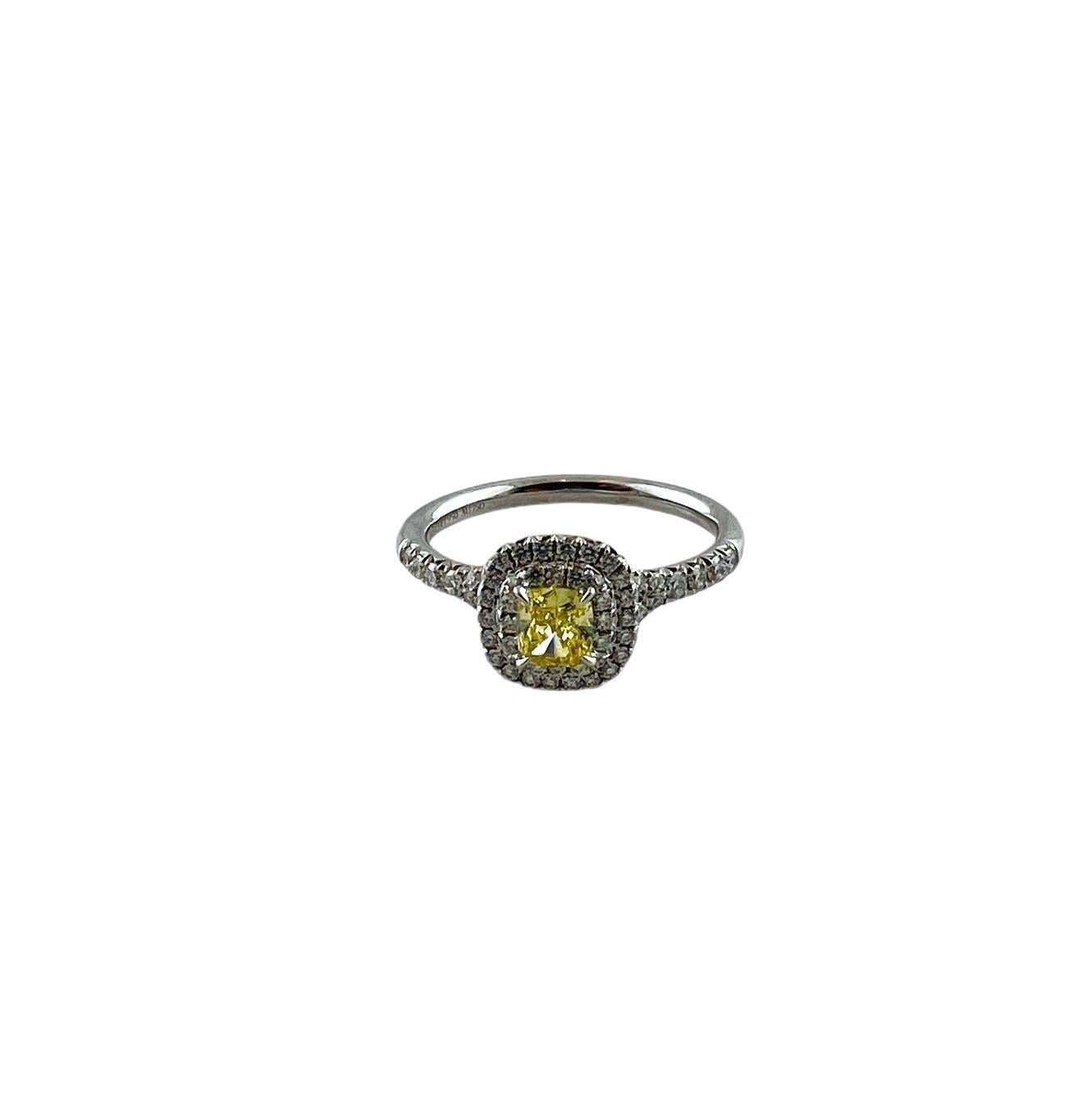 Tiffany & Co. Soleste Platinum Diamond Halo Ring

This sparkling Tiffany & Co. ring is from the Soleste collection.

Ring features a center fancy cushion cut yellow diamond that is 0.33 cts.  set in 18K white gold prongs

Halo and band are set with