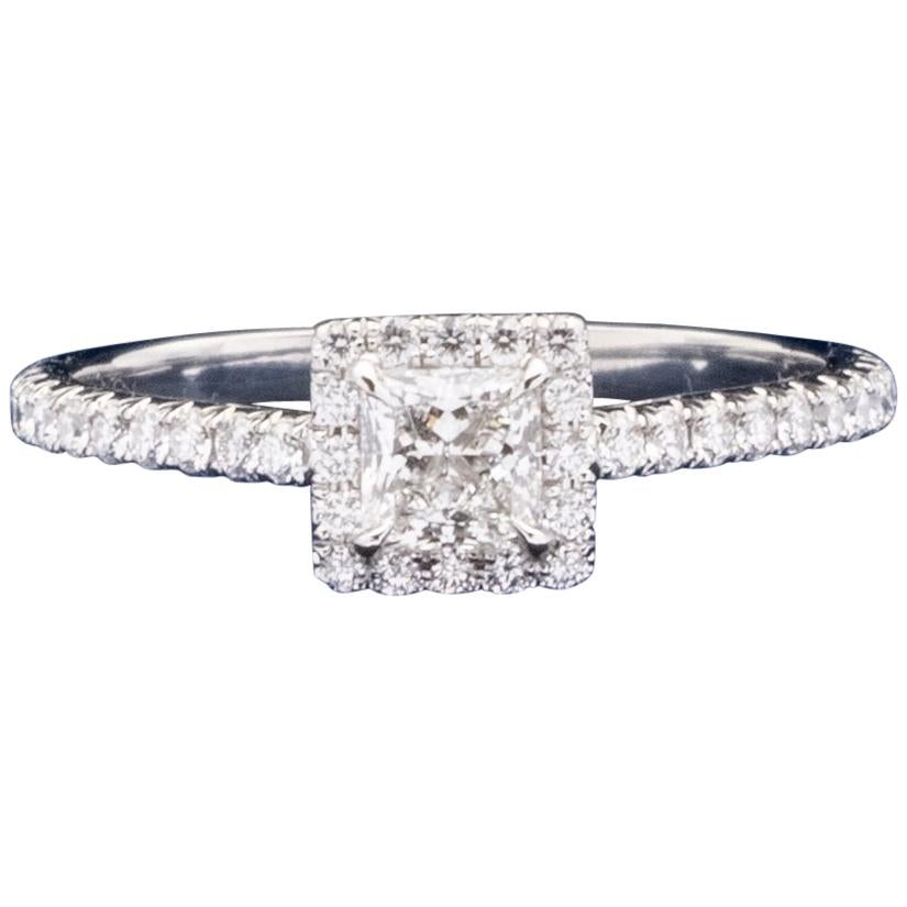 Tiffany & Co. Soleste Diamond Engagement ring featuring a .36 ct Princess Cut Center diamond finely crafted in Platinum, accented by a bead set diamond halo and shank with 36 round brilliant cut diamonds weighing 0.25 cts. total weight for a total