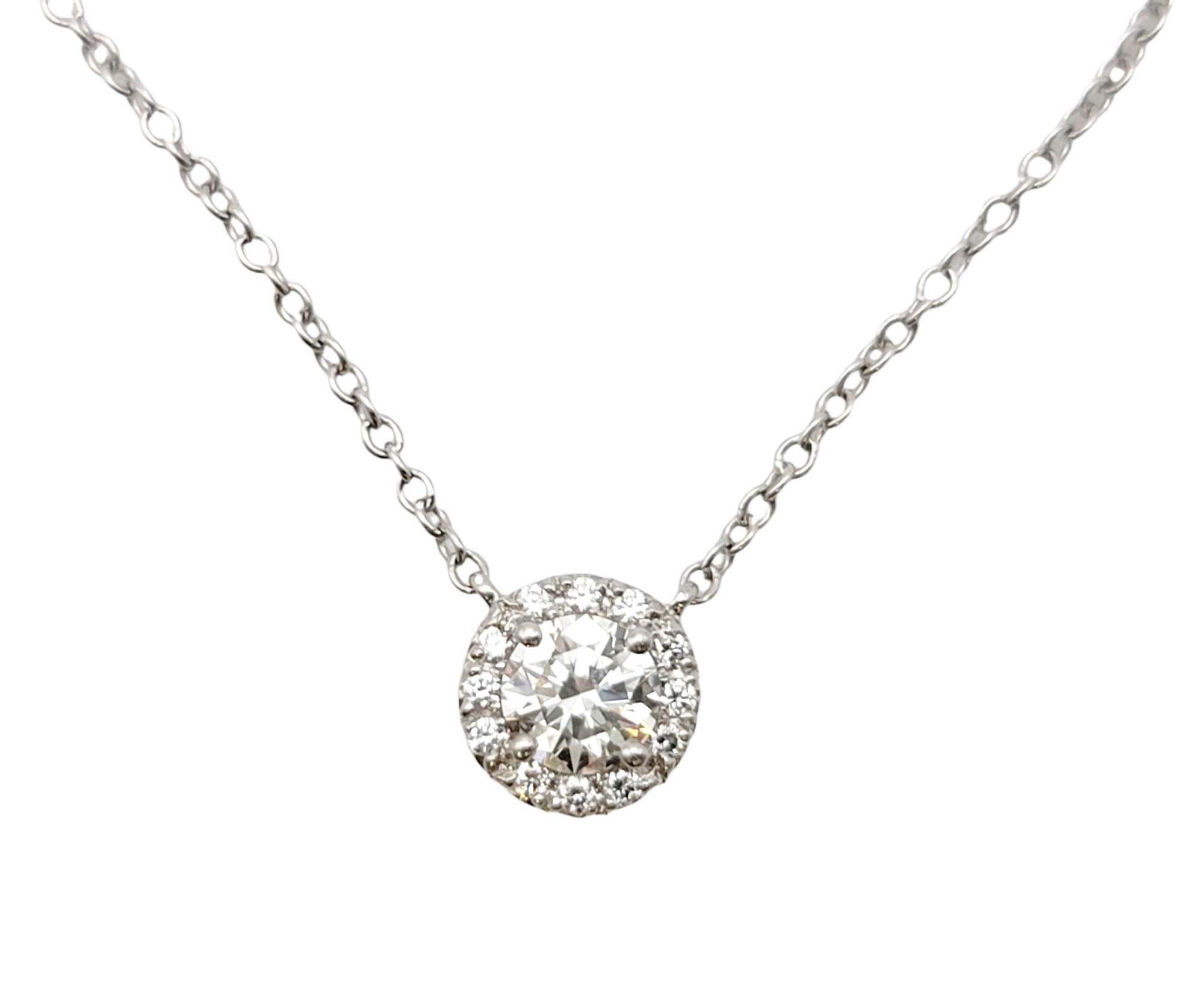 This sparkling Tiffany & Co. Soleste diamond halo pendant necklace is stunningly simple, yet undeniably beautiful. The delicate platinum chain and icy circle of natural round diamonds goes with just about everything. It features a single round