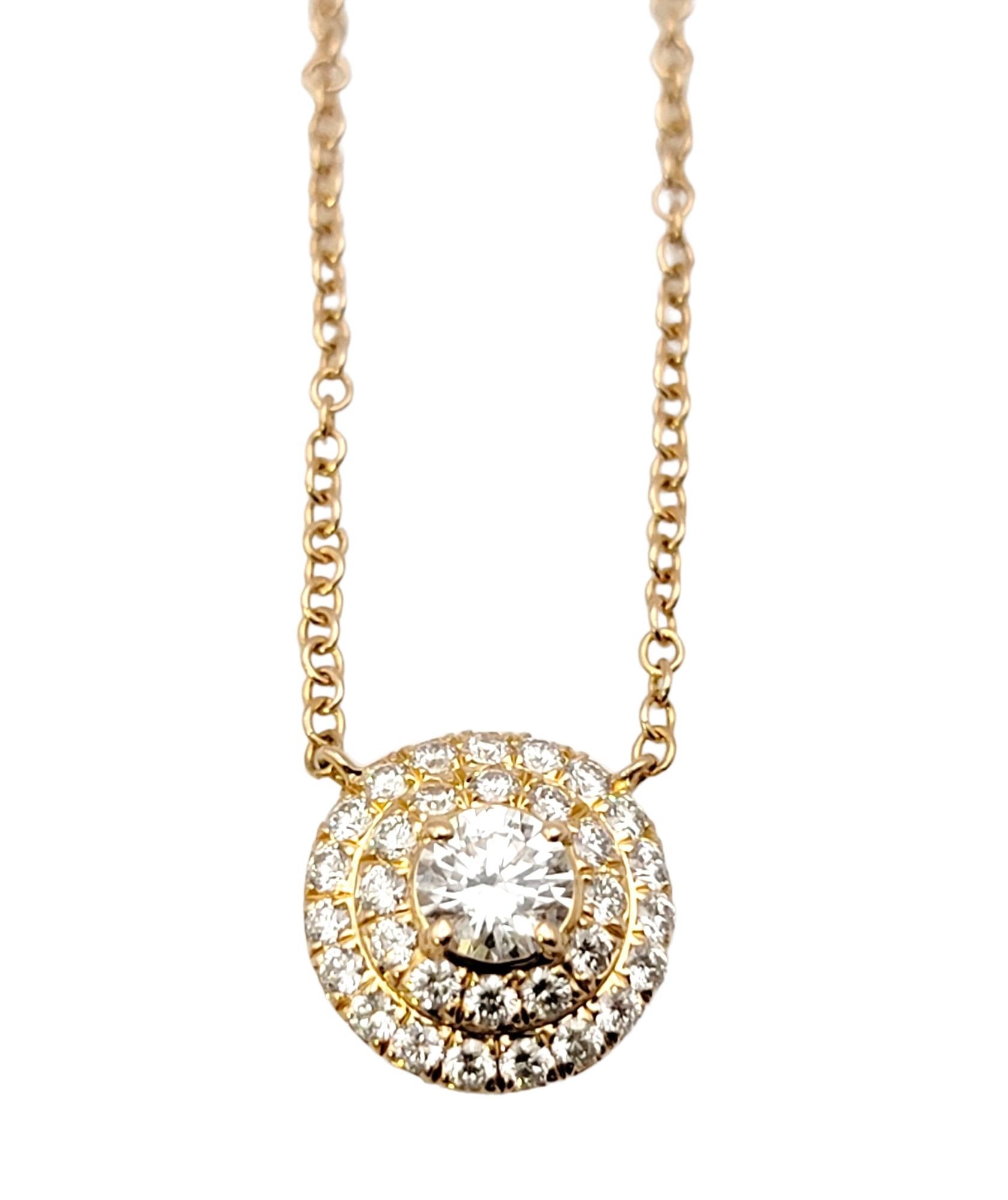 This sparkling Tiffany & Co. Soleste diamond halo pendant necklace is stunningly simple, yet undeniably beautiful. The delicate rose gold chain and icy circle of natural round diamonds goes with just about everything. It features a single round