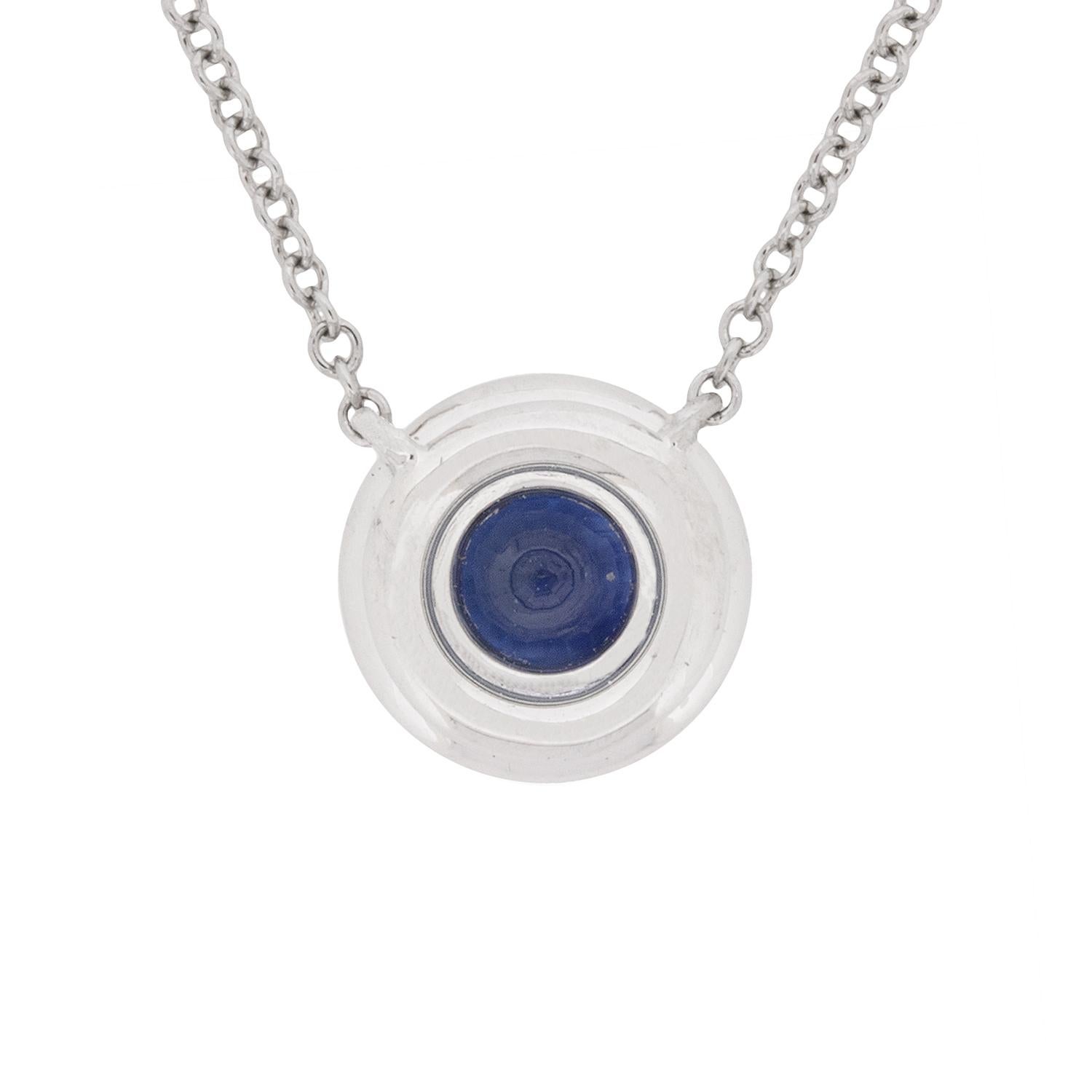 An elegant pendant from the Tiffany & Co Soleste collection. It features a wonderfully deep blue sapphire in the centre weighing 0.40 carat. The sapphire is then surrounded by a halo of high quality diamonds, weighing 0.09 carat in total. They are G