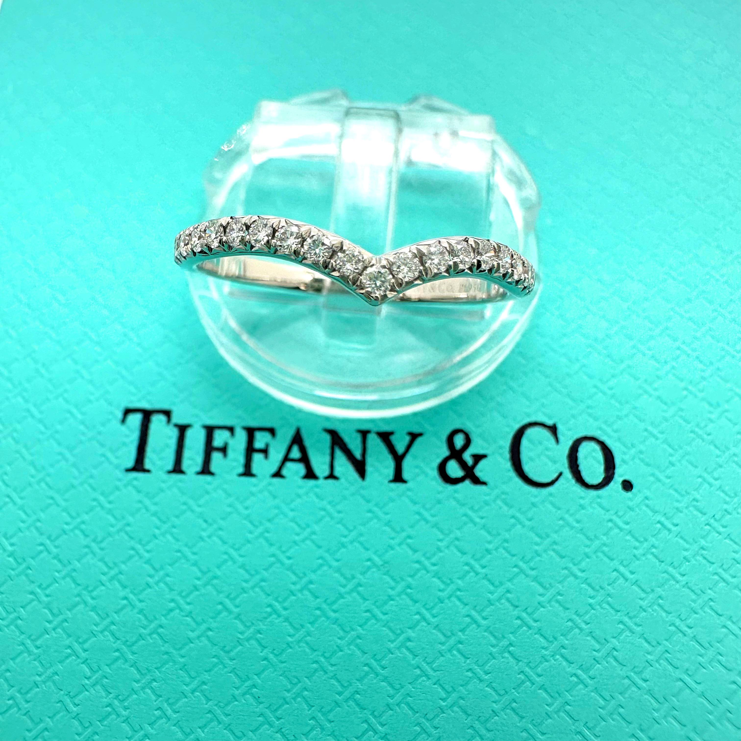 Tiffany & Co. Soleste V Ring
Style:  Band
Ref. number:  60875669
Metal:   Platinum Pt950
Size:  6.75 sizable
Measurements:   2 mm
TCW:  0.17 tcw
Main Diamond:  23 Round Brilliant Diamonds
Hallmark:  ©TIFFANY&Co. Pt950
Includes:  T&C Jewelry Pouch -