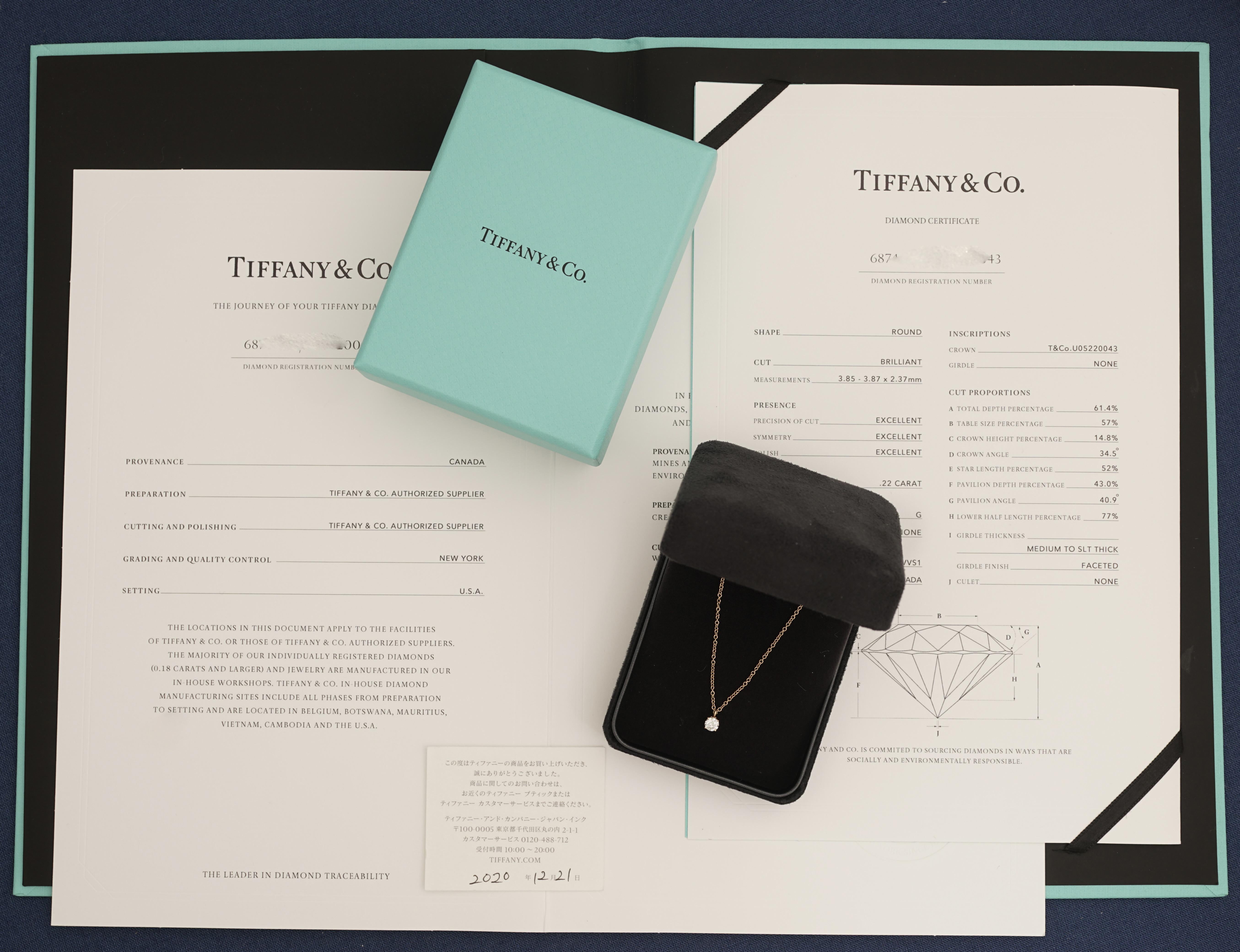 Tiffany & Co, 18K Ping Gold Solitaire Diamond Necklace,
Round Brilliant Cut
Tiffany certified 0,22 Carat, G Color and VVS1 Clarity and Triple X quality.
Mounted in 18K Ping Gold with Tiffany & co 18K Ping Gold chain.
Signed Tiffany & Co, and