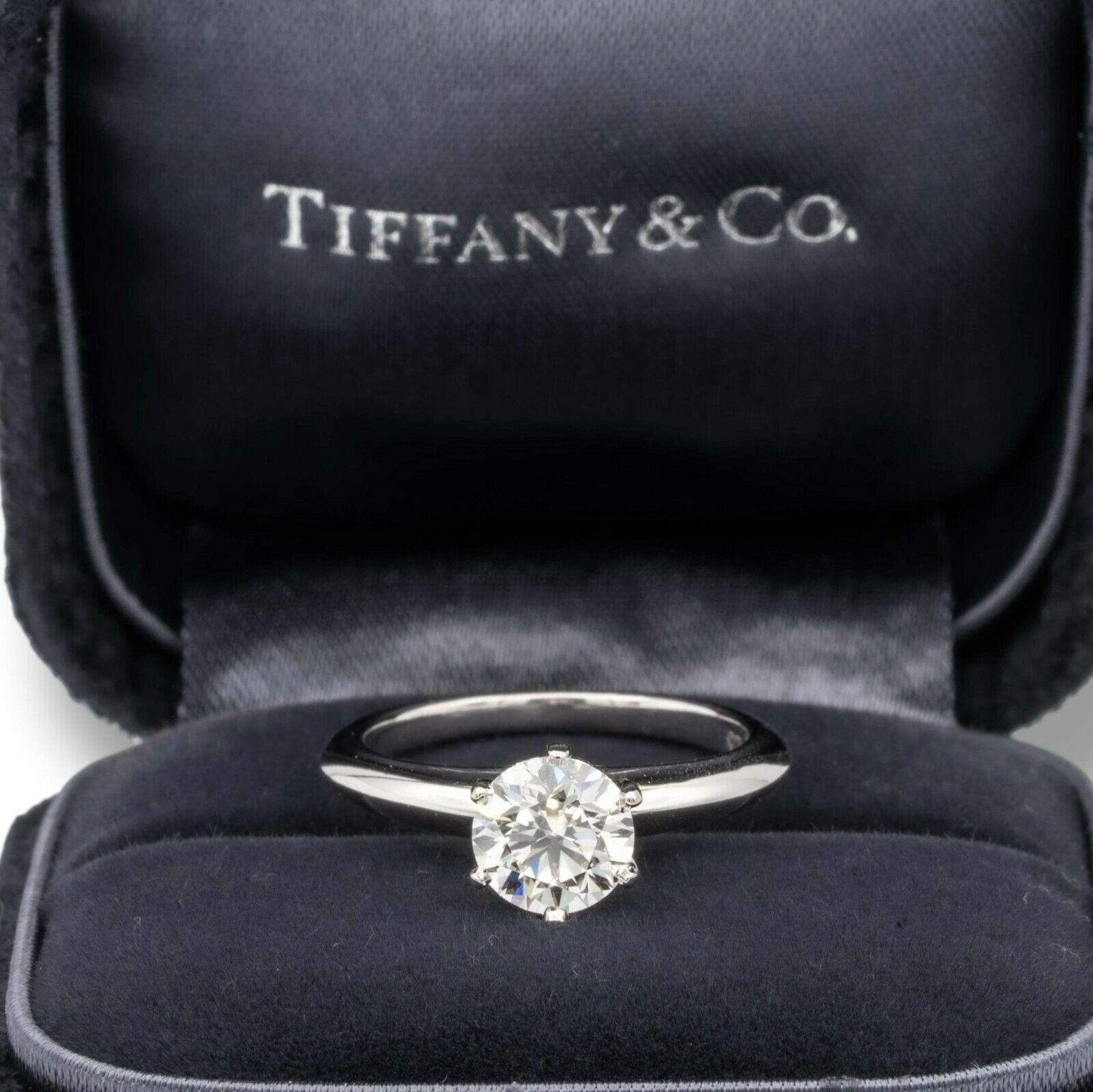 Tiffany & Co Round Brilliant Solitaire Engagement Ring featuring a 1.08 ct Center I color, VS1 clarity, finely crafted in a 6 prong Platinum Mounting. ( Current Retail for $15,200 )
Includes Original Tiffany certificate and Box. 

Stamped: Tiffany &