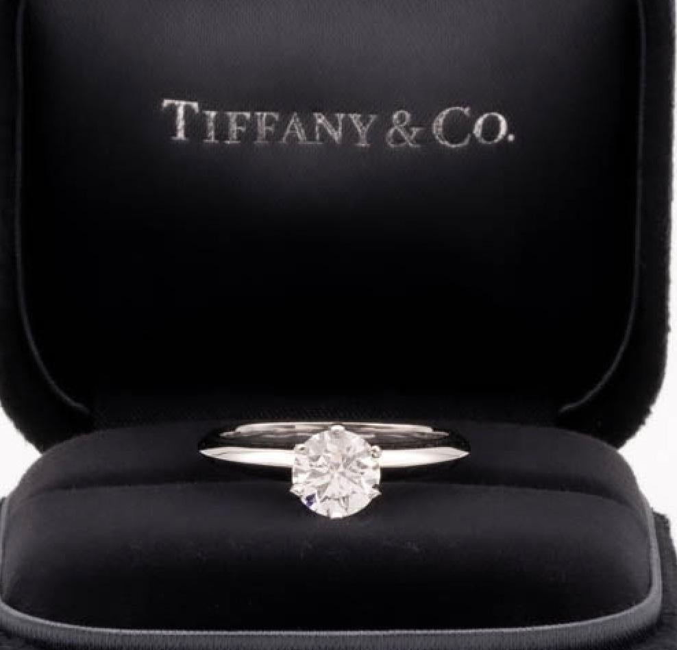 Tiffany & Co Round Brilliant Solitaire Engagement Ring featuring a 0.70 ct Center F color, VS2 clarity, finely crafted in a 6 prong Platinum Mounting. ( Current Retail for $8,700)
Includes Original Tiffany certificate and Box. 

Stamped: Tiffany &