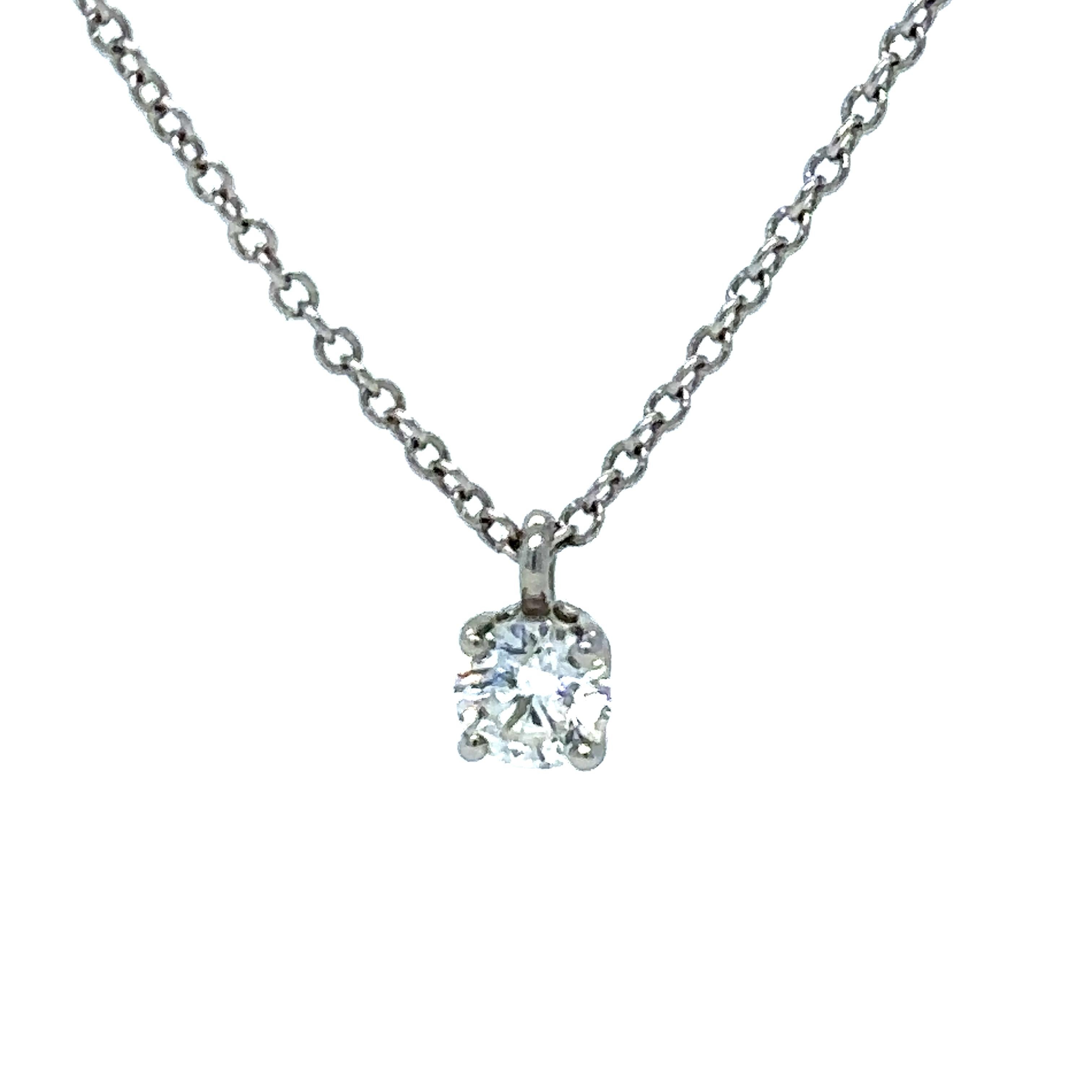 Tiffany and Co Solitaire Diamond Pendant in 18ct white gold with a round brilliant diamond. On a 16