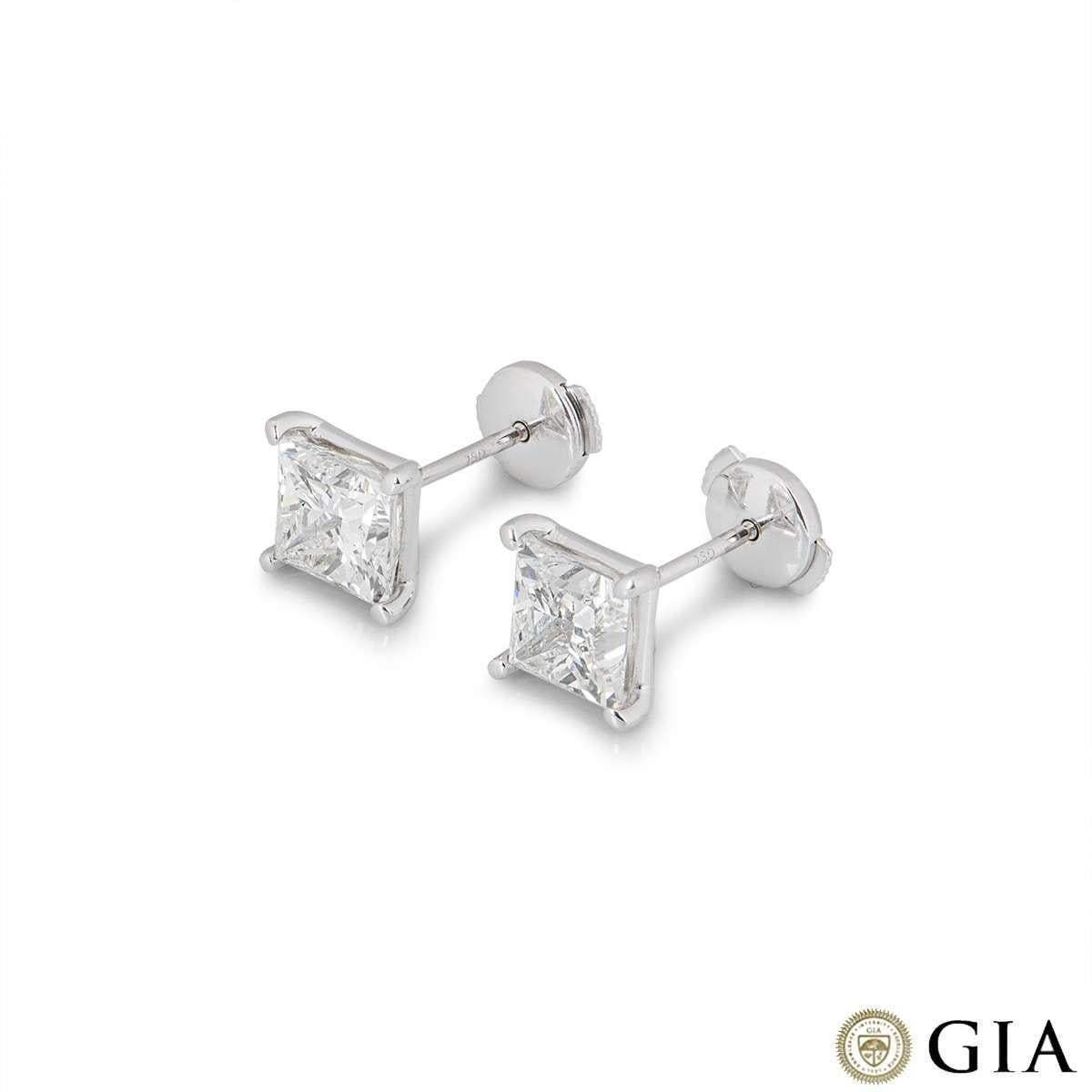 A traditional pair of diamond ear studs in platinum by Tiffany & Co. Each earring is set with a round brilliant cut diamond weighing 0.62ct, I colour and SI1 in clarity, set in a classic four claw setting. The earrings feature post and screw back