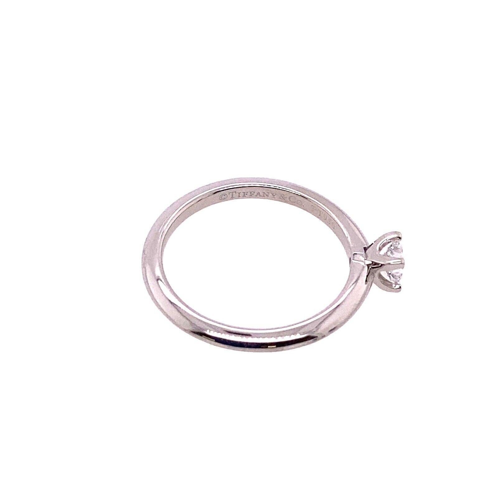 This gorgeous Tiffany & Co. Solitaire diamond ring Set with 0.21ct F VS princess cut diamond can make a perfect engagement ring.

Additional Information: 
Total Diamond Weight: 0.21ct
Diamond Colour: E
Diamond Clarity: VS
Width of Band: 1.7mm
Width