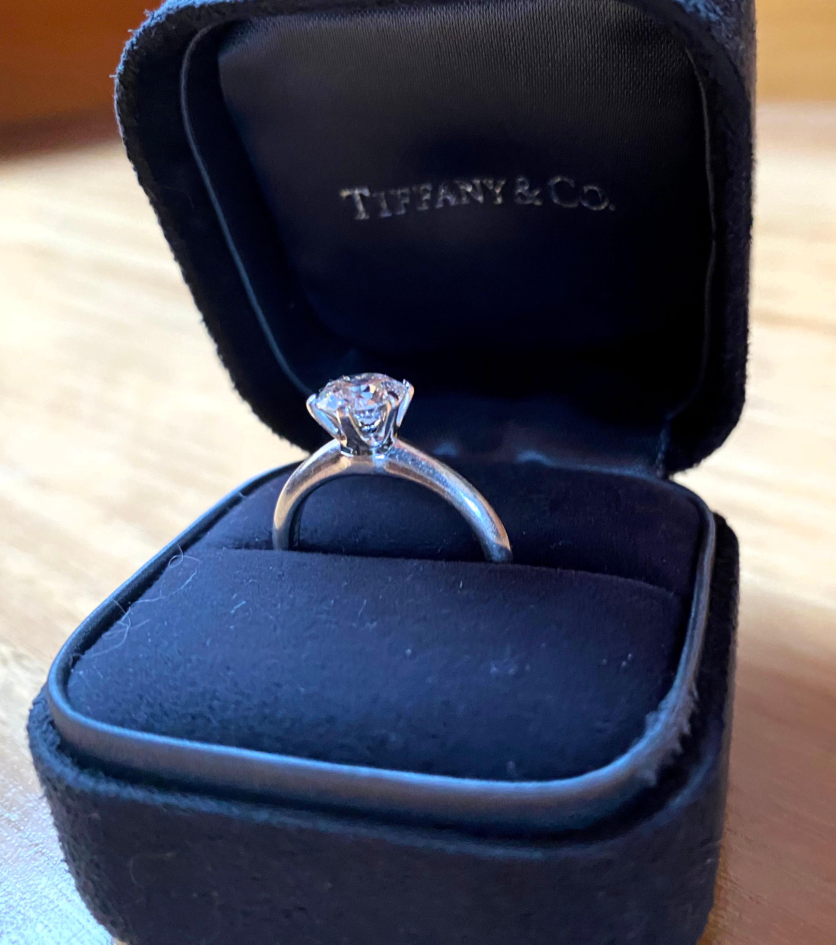 Unique features: 
Tiffany & Co platinum solitaire diamond ring approx. 5 grams in weight. The ring contains one round brilliant cut diamond, 1.29 carat, G colour, VS2 clarity, 

Metal: Platinum PT950
Carat: 1.29ct
Colour: G
Clarity: VS2
Cut: Round