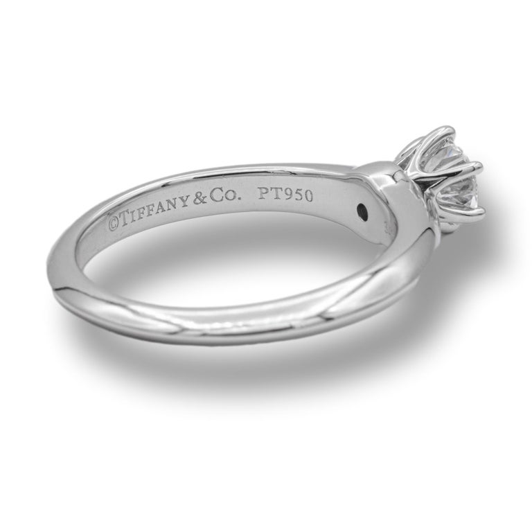 Tiffany & Co Round Brilliant Solitaire Engagement Ring featuring a 0.50 ct Center G color, VVS2 clarity, finely crafted in a 6 prong Platinum Mounting. ( Current Retail for $5,600)
Includes Original Tiffany certificate and Box. 

Stamped: Tiffany &