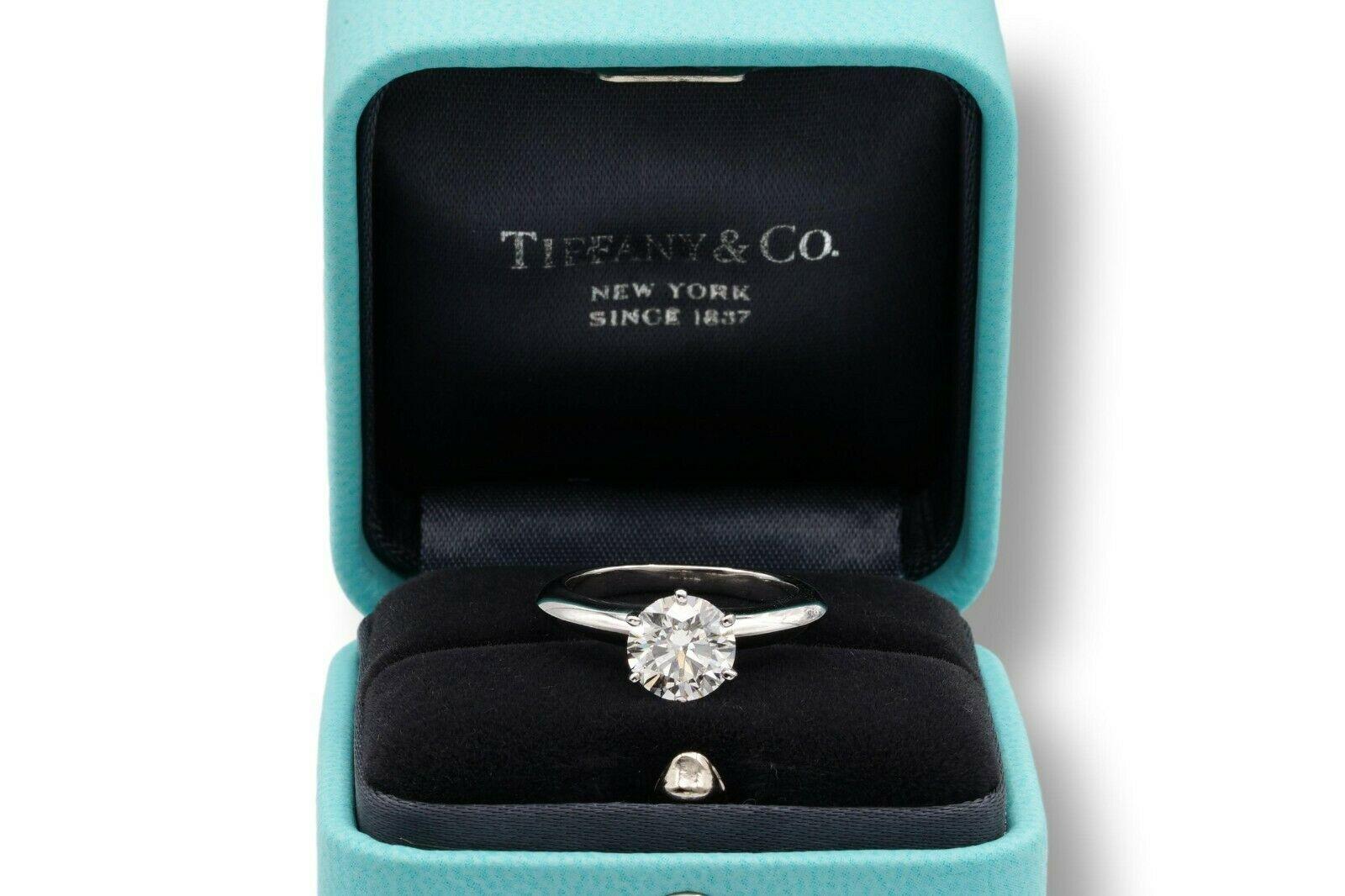 Tiffany & Co Round Brilliant Classic Solitaire Engagement Ring featuring a 1.36 ct Center G color, VS1 clarity, finely crafted in a 6 prong Platinum Mounting. 
( Current Retail for $25,500)

Stamped: Tiffany & Co. PT 950 35450017, D 1.36 CT
Size:
