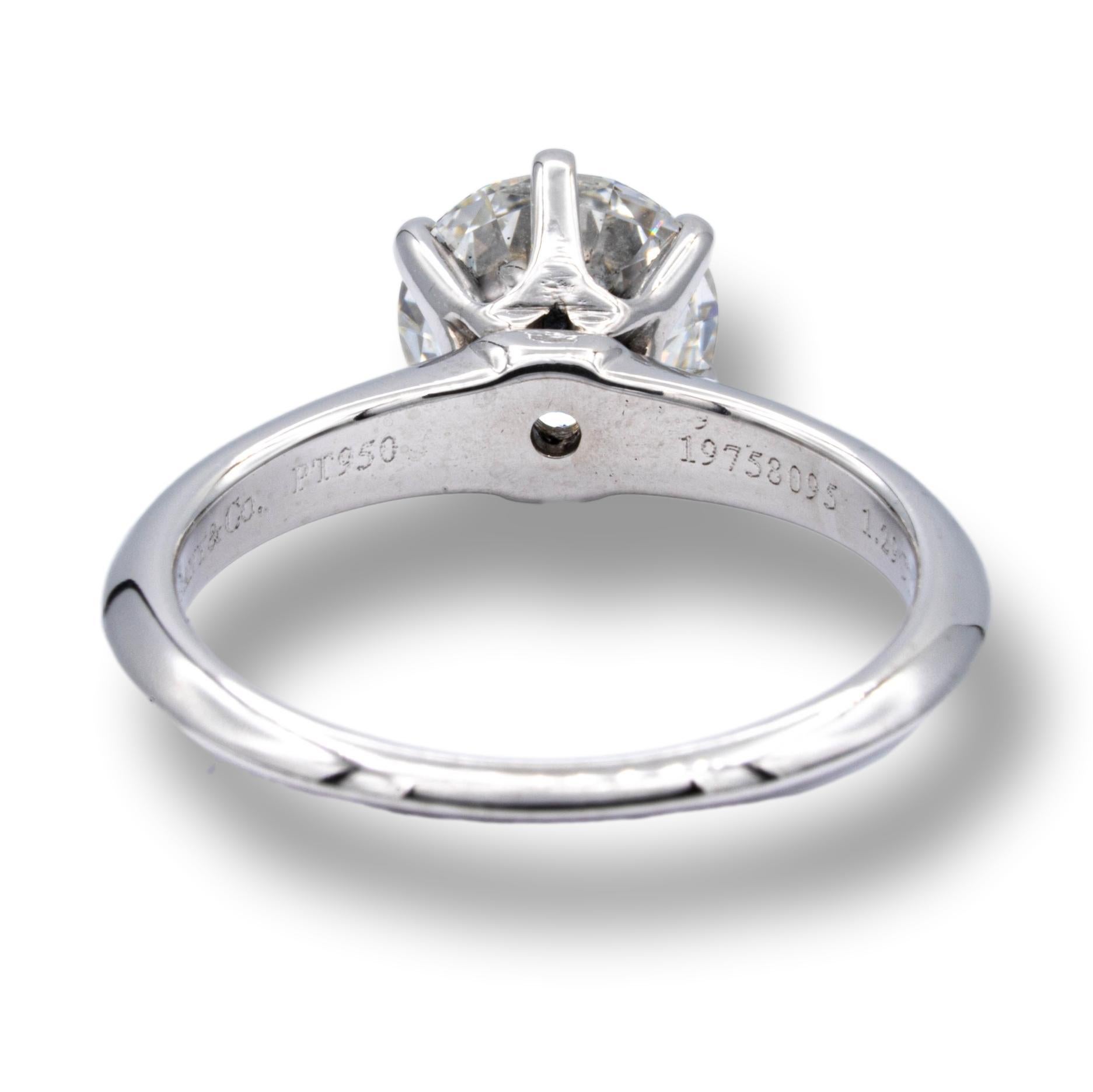 Tiffany & Co Round Brilliant Classic Solitaire Engagement Ring featuring a 1.29 ct Center H color, VS2 clarity, finely crafted in a 6 prong Platinum Mounting. This ring includes a Tiffany Certificate and a GIA (Gemological Institute of America)