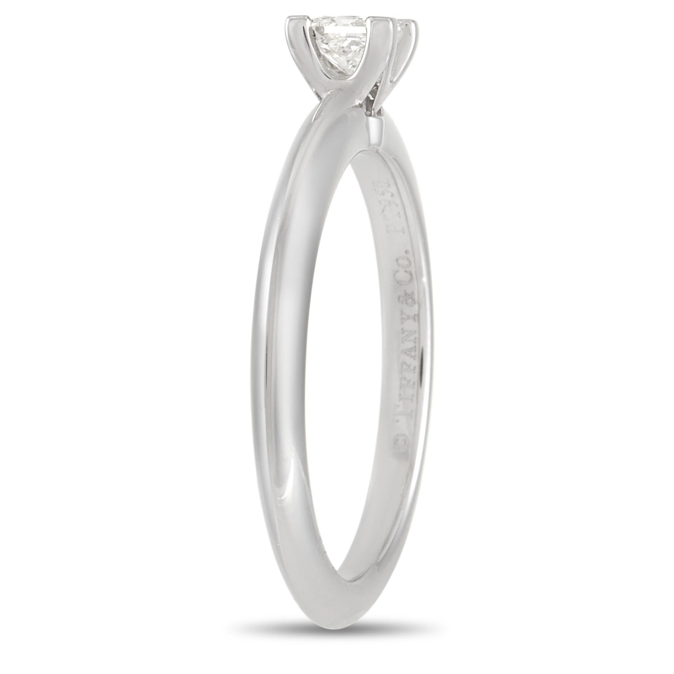 This Tiffany & Co. Platinum 0.20 ct Diamond Ring is a classic piece just begging to be worn. The simple band is made with Platinum highlighting a 0.20 carat princess-cut diamond with H color and VS2 clarity that is held in place by four prongs. The