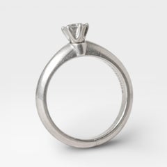 Tiffany & Co. Solitaire Round Cut 0.22 Ct. Platinum Engagement Ring.