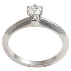 Tiffany & Co. Solitaire Round Cut 0.22 Ct. Platinum Engagement Ring.